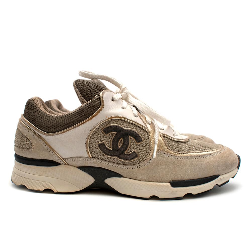 Chanel Beige Leather CC Trainers 

-Trendy desirable style 
-Made of soft leather and mesh for comfort 
-Legendary CC logo to the sides 
-Gorgeous golden trims 
-CC logo embroidery to the tongue 
-Rubber soles for adherence
-Original box