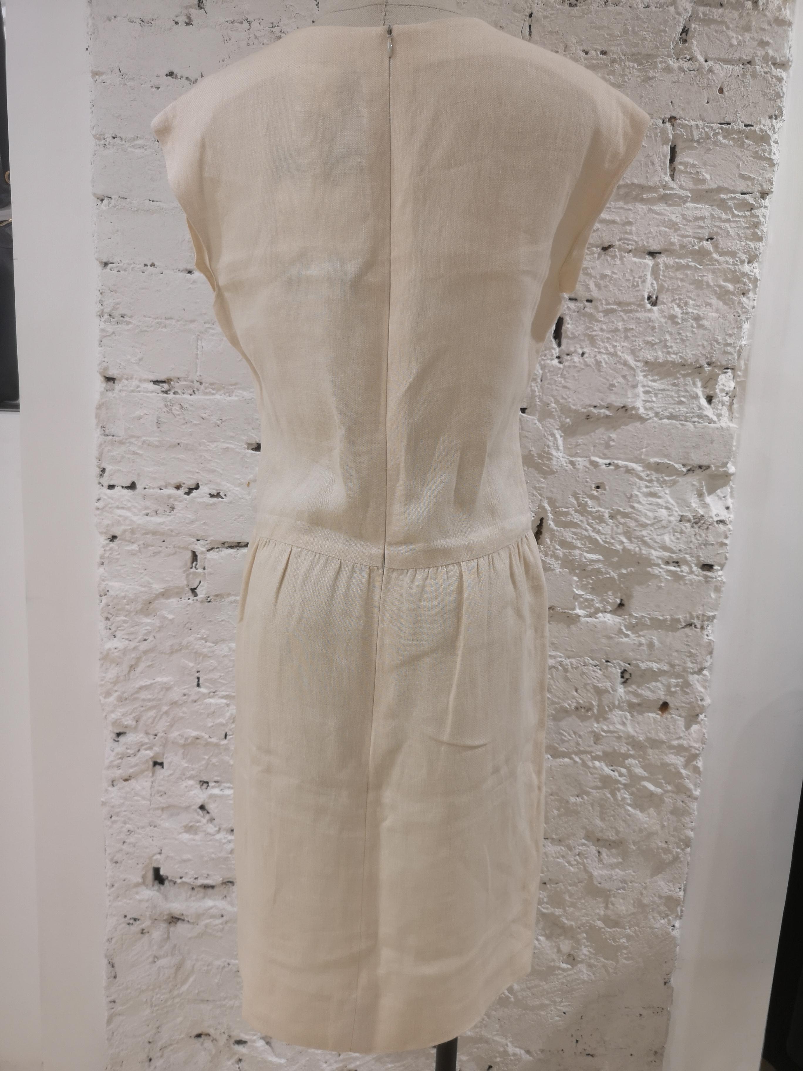 Chanel beige linen dress
embellished with cc buttons
Size: 42 fr
waist 44 cm
lenght 99 cm
shoulders 50 cm
