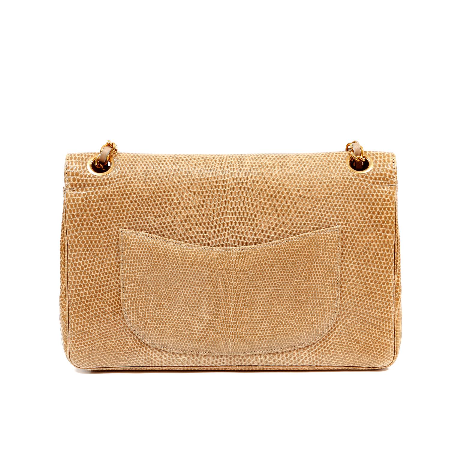 This authentic Chanel Beige Lizard Medium Classic Flap is in excellent vintage condition.  It has enjoyed a previous life and may have some small imperfections. Lizard is a highly collectible exotic and considered quite rare.
Neutral beige lizard