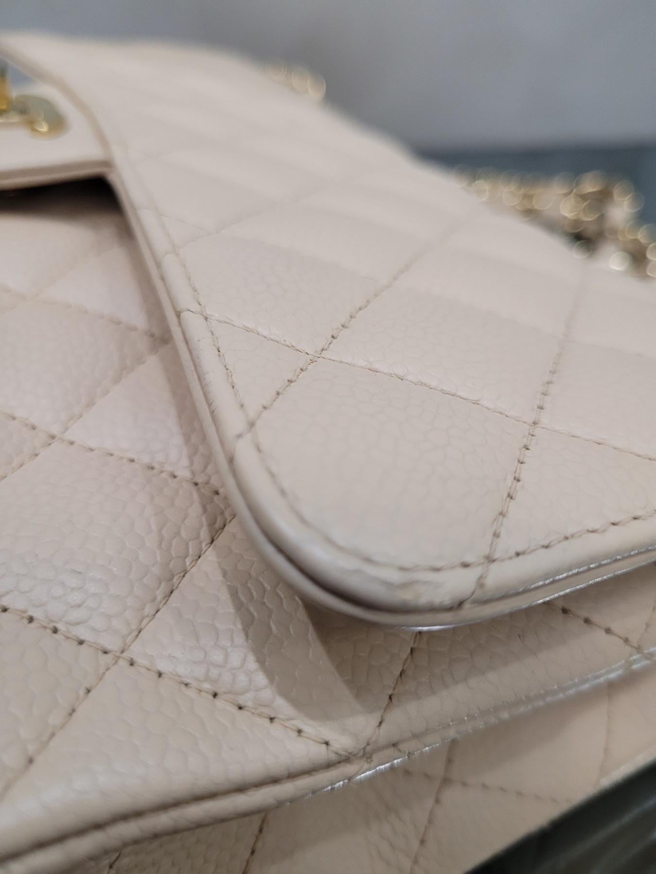 Authentic Chanel Beige Medium Caviar Timeless Classic Flap Bag.

This bag is in excellent condition and has been well cared for. The caviar leather is durable and luxurious, and the timeless design will never go out of style.

It's the perfect bag