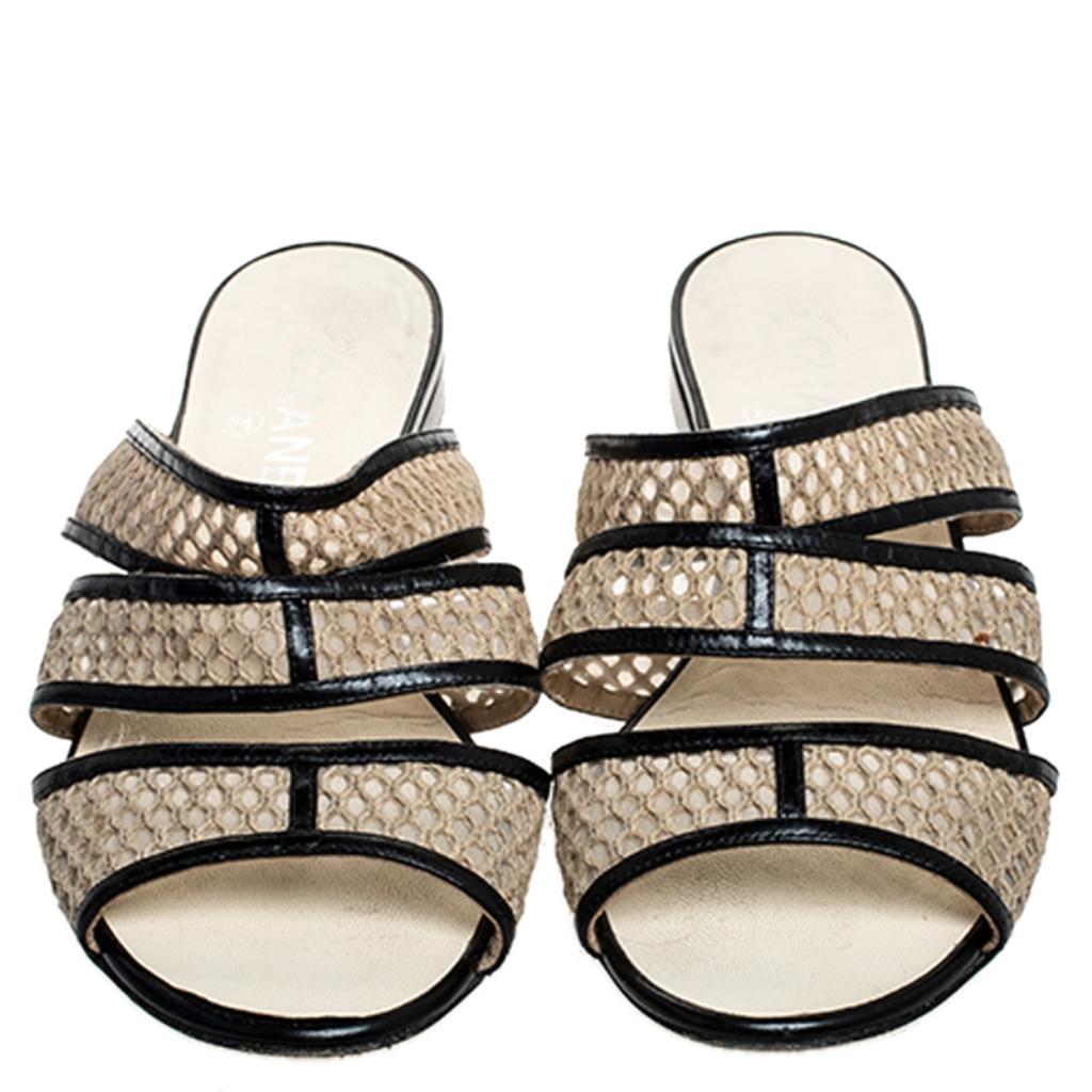 These slides from Chanel are pretty and easy to slip on. Made in Italy, they feature mesh straps with leather and short heels detailed with the CC logo and sized to provide comfort at every step. This is one pair that speaks high-fashion in a