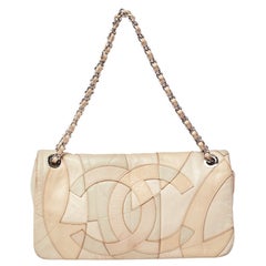 Chanel - Sac à rabat accordéon en cuir beige patchwork