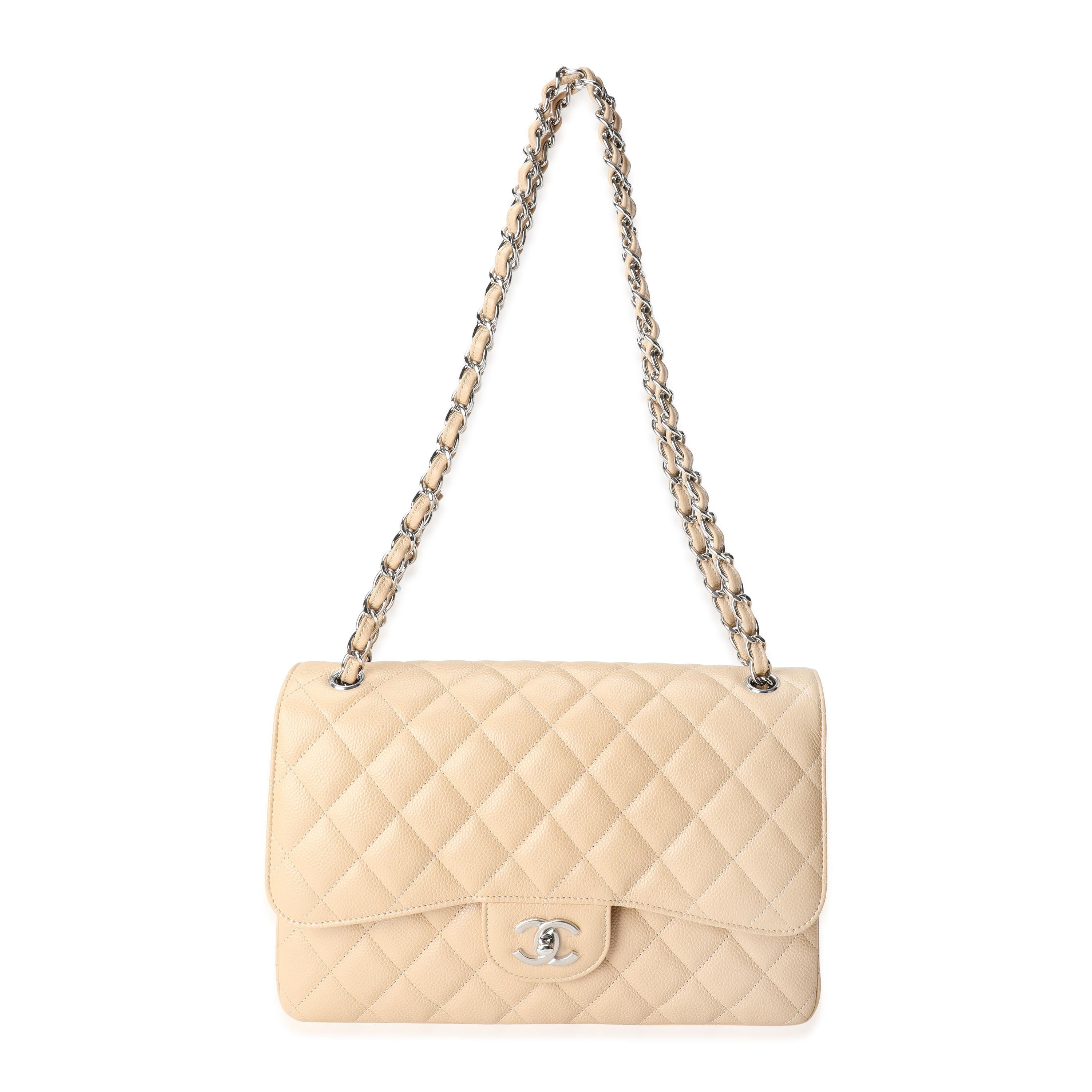 Listing Title: Chanel Beige Quilted Caviar Jumbo Classic Double Flap Bag
SKU: 117389
MSRP: 9500.00

Handbag Condition: Excellent
Condition Comments: Excellent Condition. Plastic on some hardware. No visible signs of wear.
Brand: Chanel
Model: