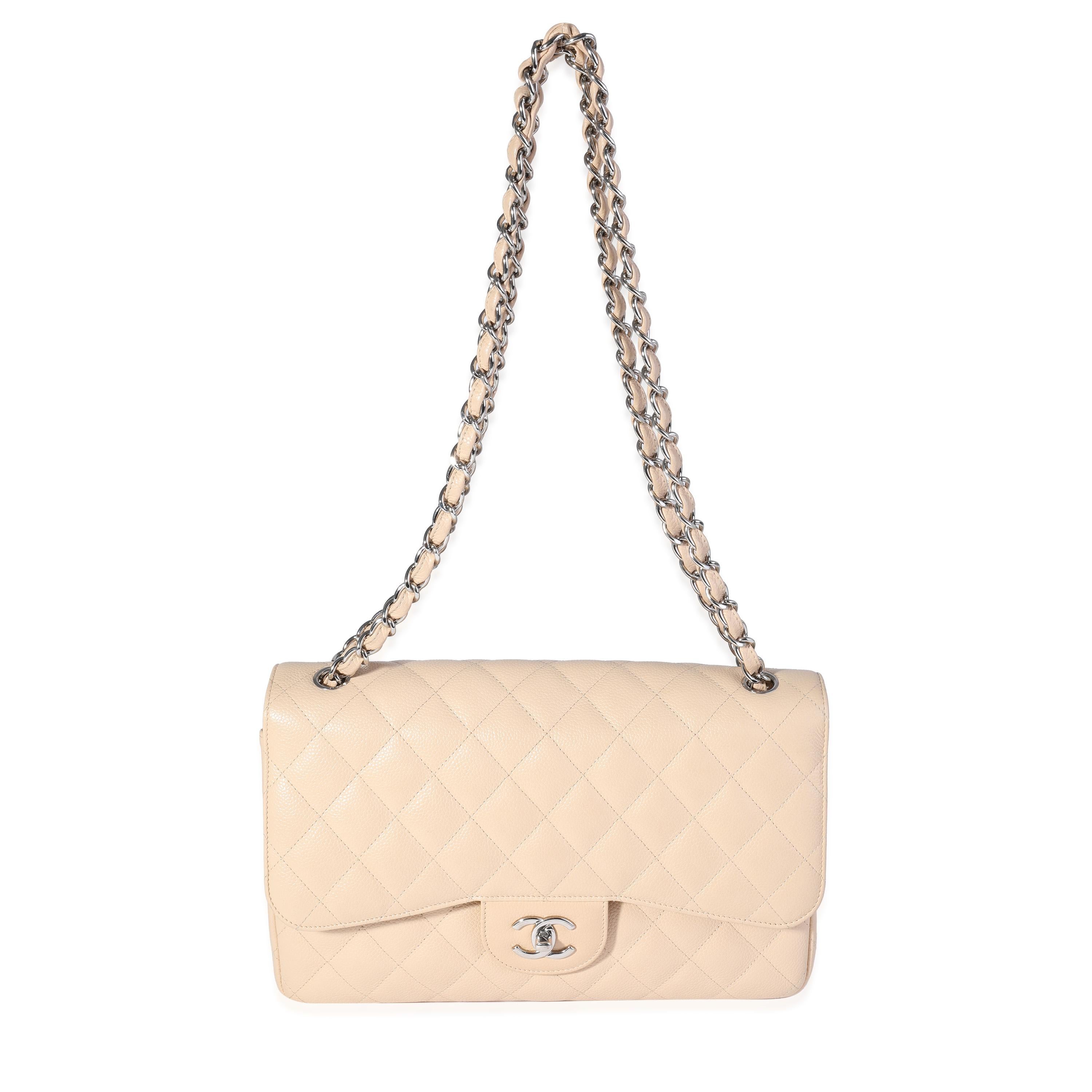 Listing Title: Chanel Beige Quilted Caviar Jumbo Classic Double Flap Bag
SKU: 120683
MSRP: 9500.00

Handbag Condition: Very Good
Condition Comments: Very Good Condition. Scuffing throughout. Scratching to hardware.
Brand: Chanel
Model: Classic