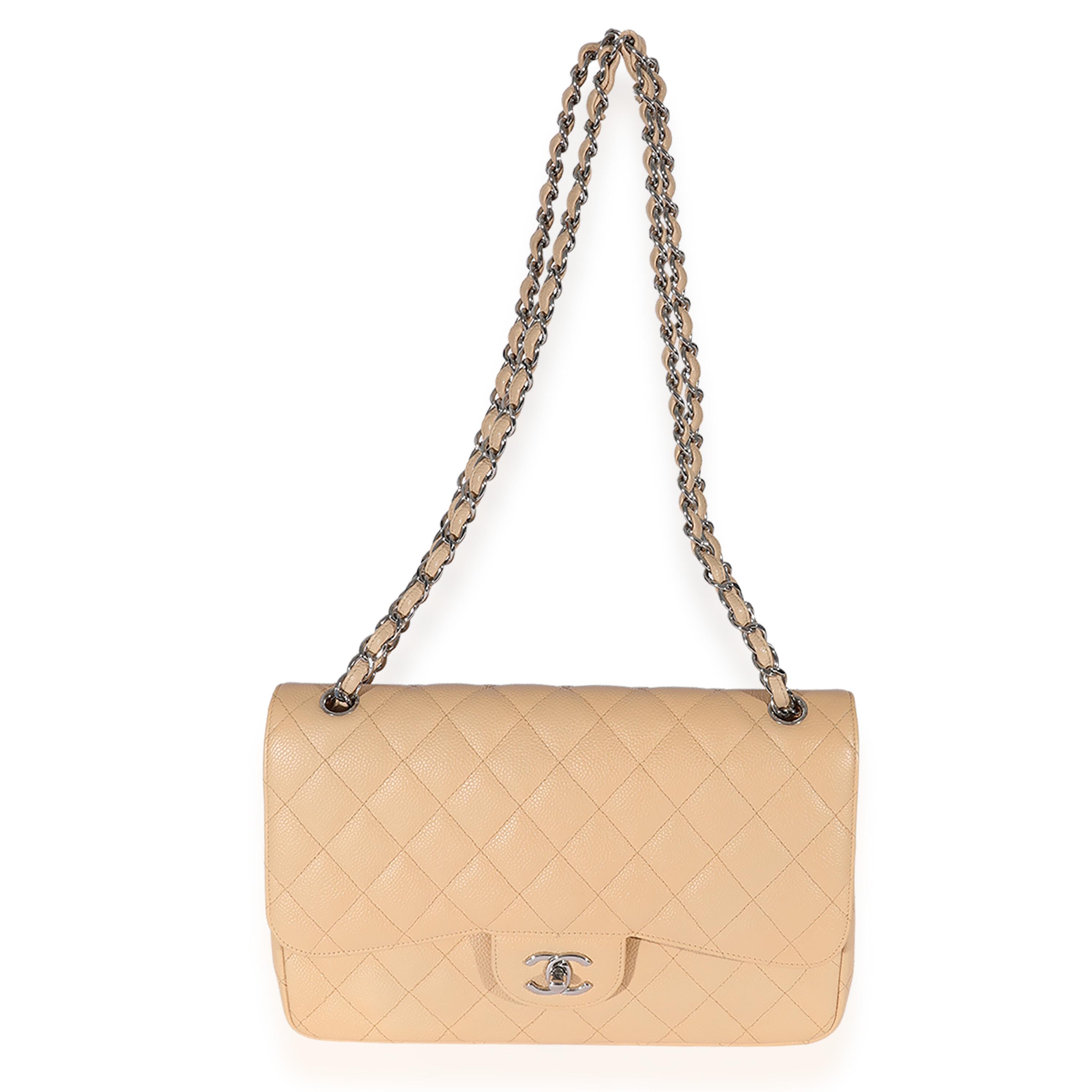 Listing Title: Chanel Beige Quilted Caviar Jumbo Classic Double Flap Bag
SKU: 125840
MSRP: 9500.00
Condition: Pre-owned 
Handbag Condition: Very Good
Condition Comments: Very Good Condition. Light scuffing throughout and at corners. Scratching at