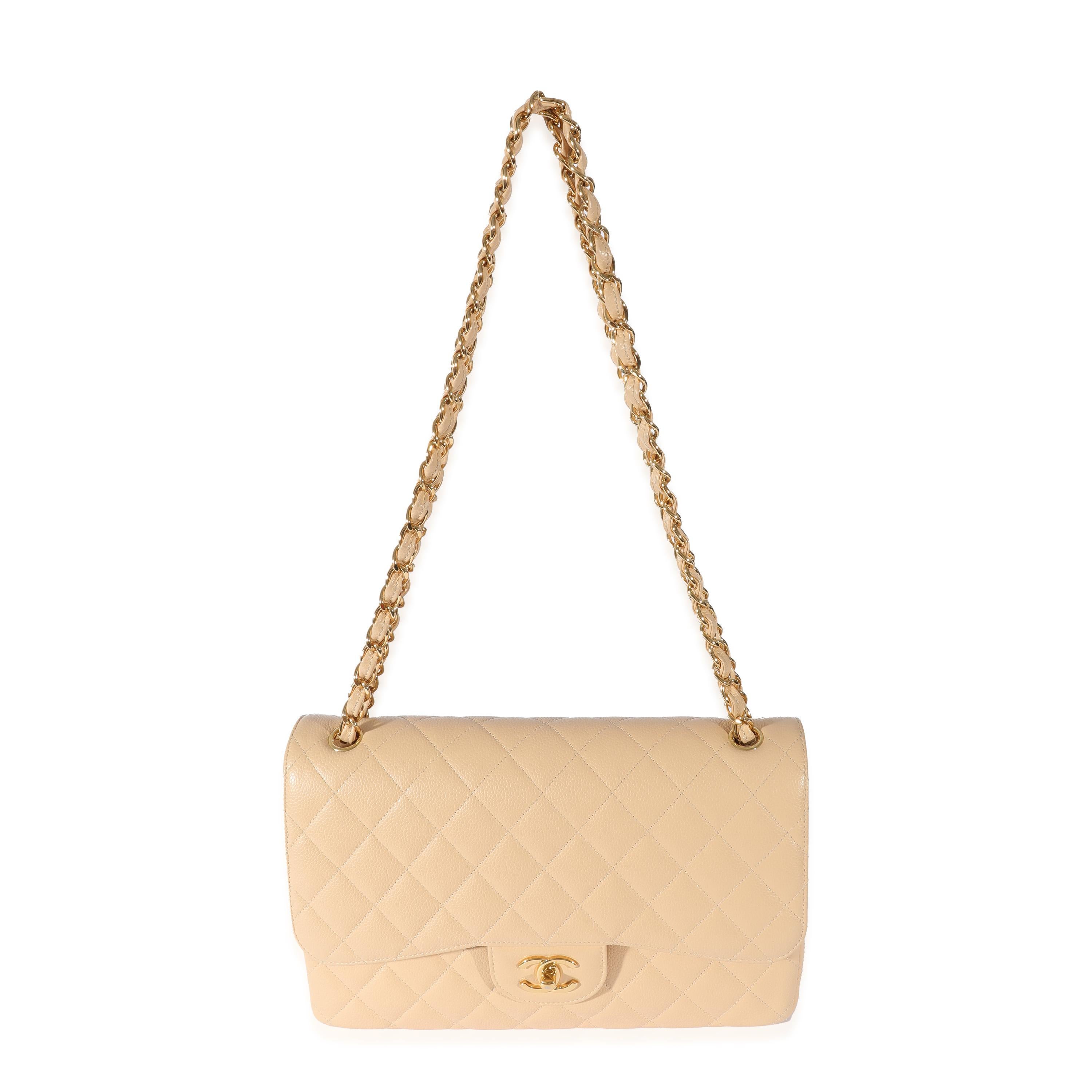 Listing Title: Chanel Beige Quilted Caviar Jumbo Classic Double Flap Bag
 SKU: 128483
 MSRP: 9500.00
 Condition: Pre-owned 
 Condition Description: A timeless classic that never goes out of style, the flap bag from Chanel dates back to 1955 and has