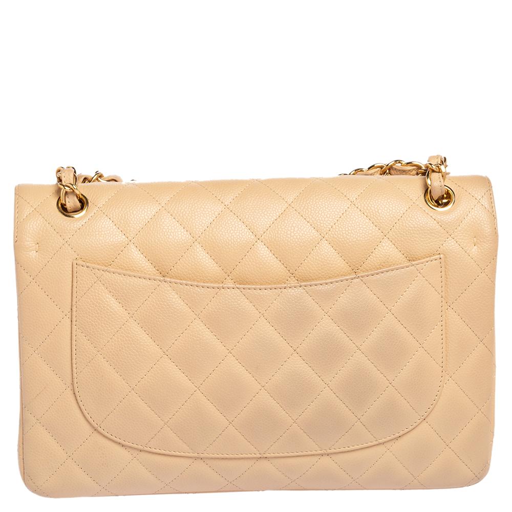 We are in utter awe of this flap bag from Chanel as it is appealing in a surreal way. Exquisitely crafted from Caviar leather in their quilt design, it bears their signature label on the leather interior and the iconic CC turn-lock on the flap. The
