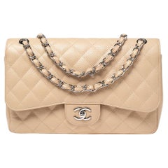 Chanel, a beige 'Caviar Jumbo Classic Flap Bag', vintage. - Bukowskis
