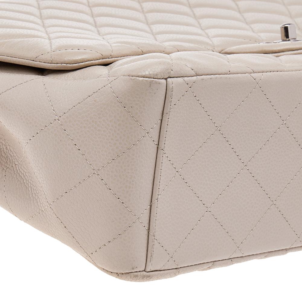We're bringing Chanel's iconic Classic Flap bag to your closet with this beautiful beige creation. Exquisitely crafted from quilted Caviar leather, it bears the signature label inside the leather interior and the iconic CC turn-lock on the flap. The