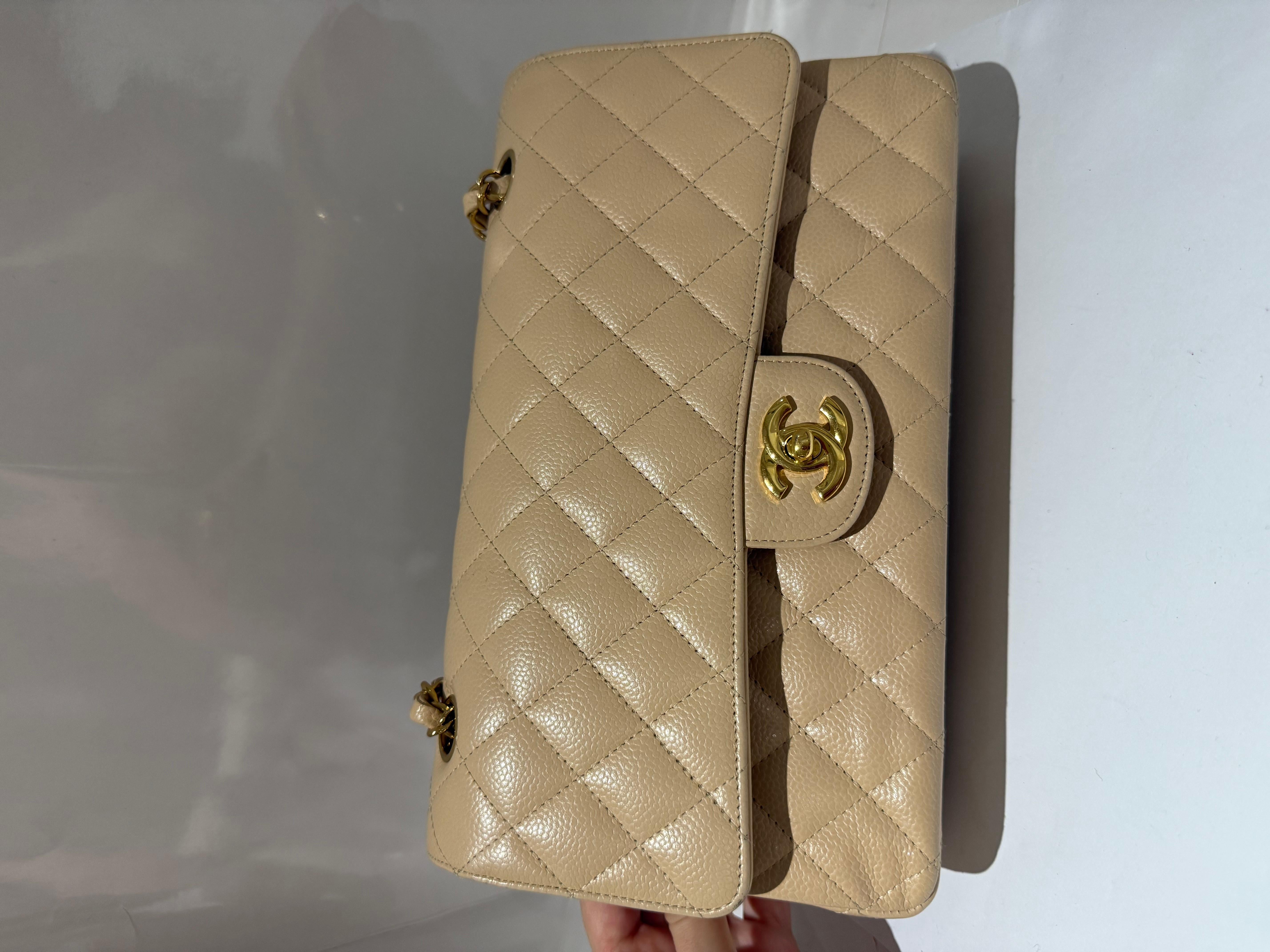 Chanel Beige Quilted Caviar Leather Medium Classic Double Flap Bag with gold hardware. In very good condition. Comes with dustbag and box. 