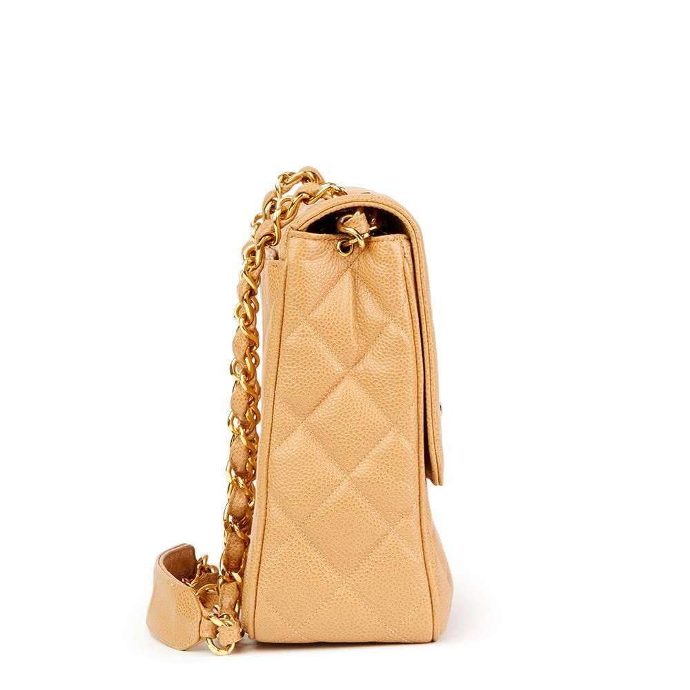 CHANEL
Beige Quilted Caviar Leather Vintage XL Classic Single Flap Bag

Reference: HB1809
Serial Number: 3014870
Age (Circa): 1996
Accompanied By: Authenticity Card
Authenticity Details: Serial Sticker, Authenticity Card (Made in France)
Gender: