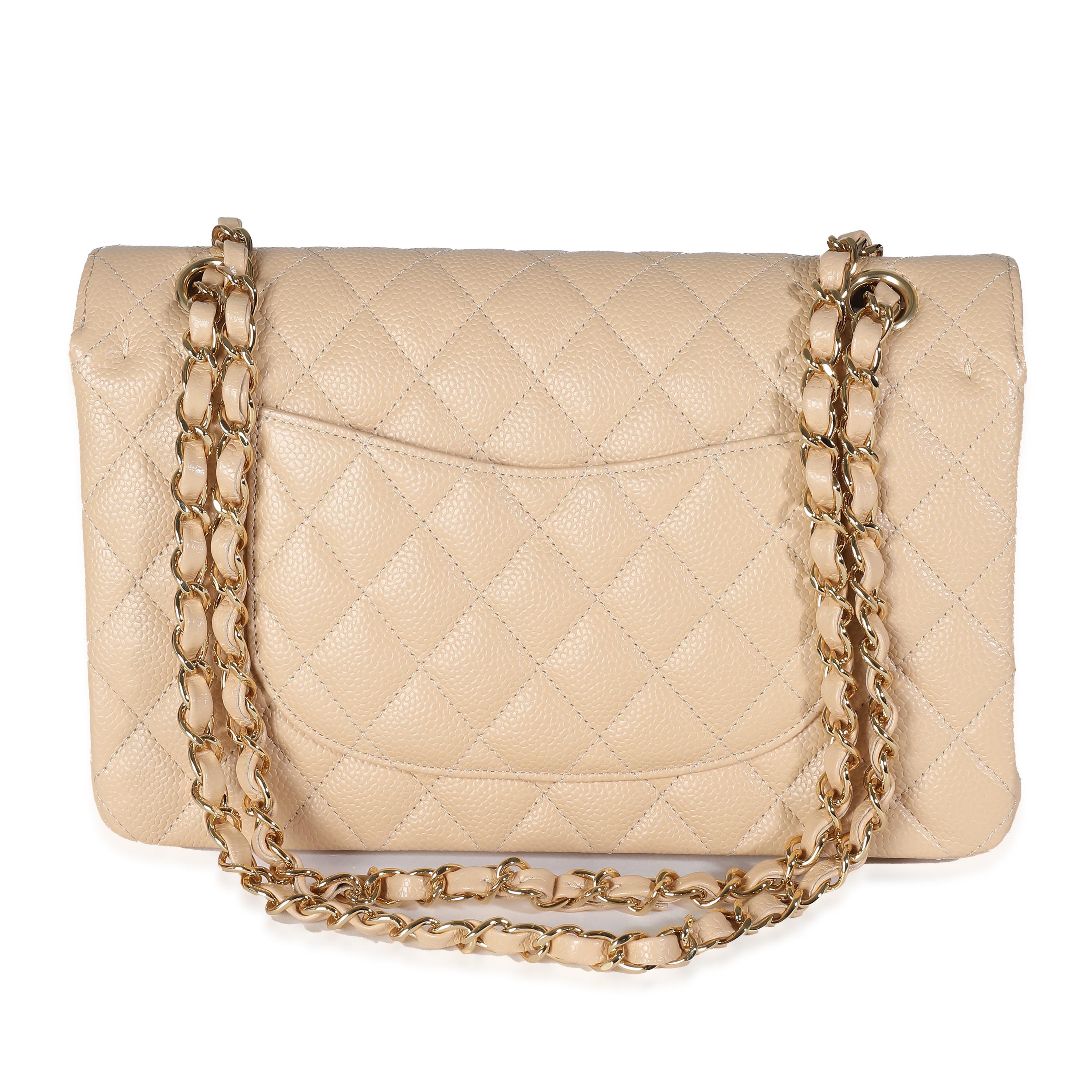 Listing Title: Chanel Beige Quilted Caviar Medium Classic Double Flap Bag
SKU: 141032
MSRP: 10800.00 USD
Condition: Pre-owned 
Condition Description: A timeless classic that never goes out of style, the flap bag from Chanel dates back to 1955 and