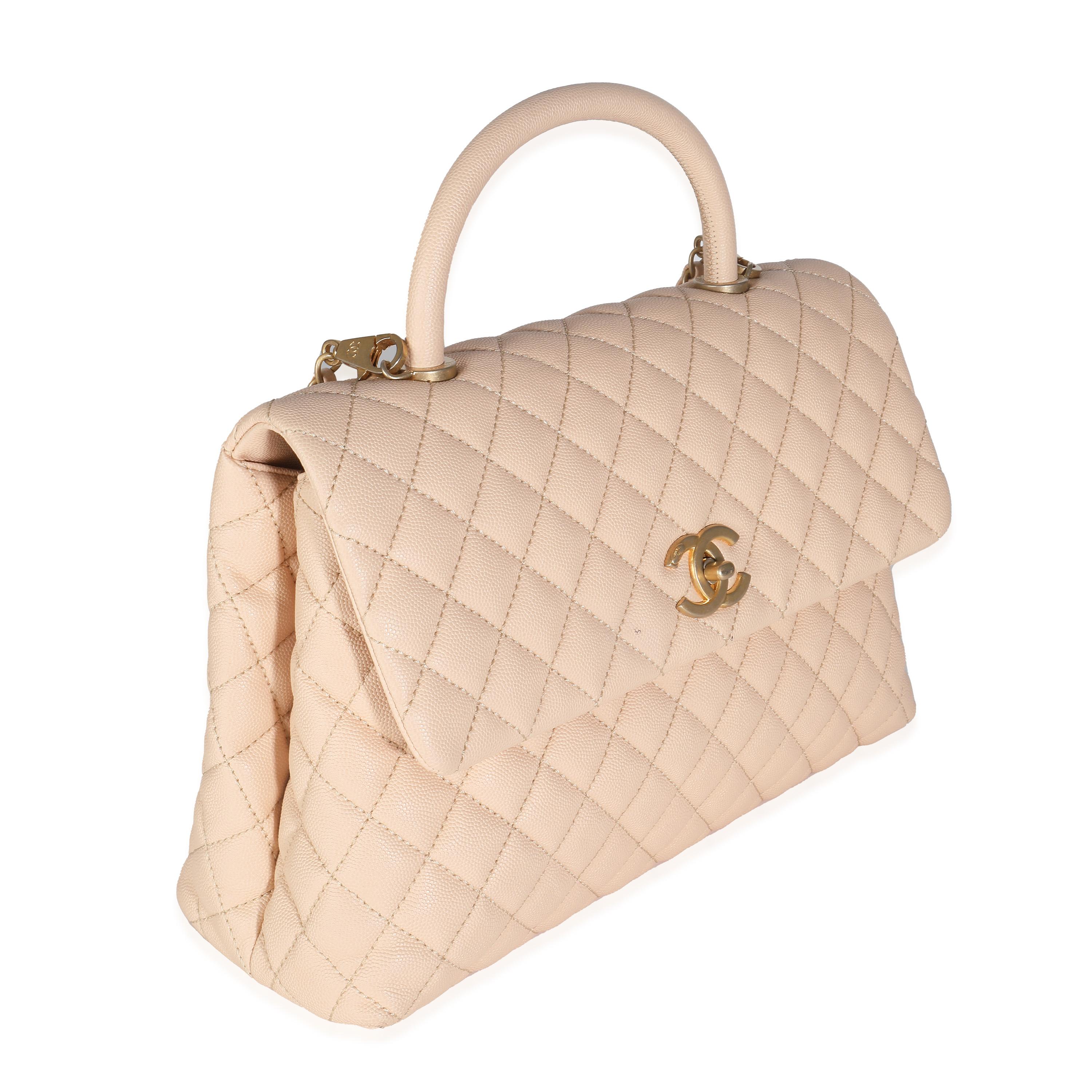 Listing Title: Chanel Beige Quilted Caviar Medium Coco Top Handle Bag
SKU: 141925
Condition: Pre-owned 
Condition Description: Intrinsically Chanel, the medium Coco top handle bag was named after the maison's founder. Introduced in 2015, the bag