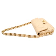 Chanel Beige Quilted Lambskin Interlocking CC Chain Flap Bag 2024