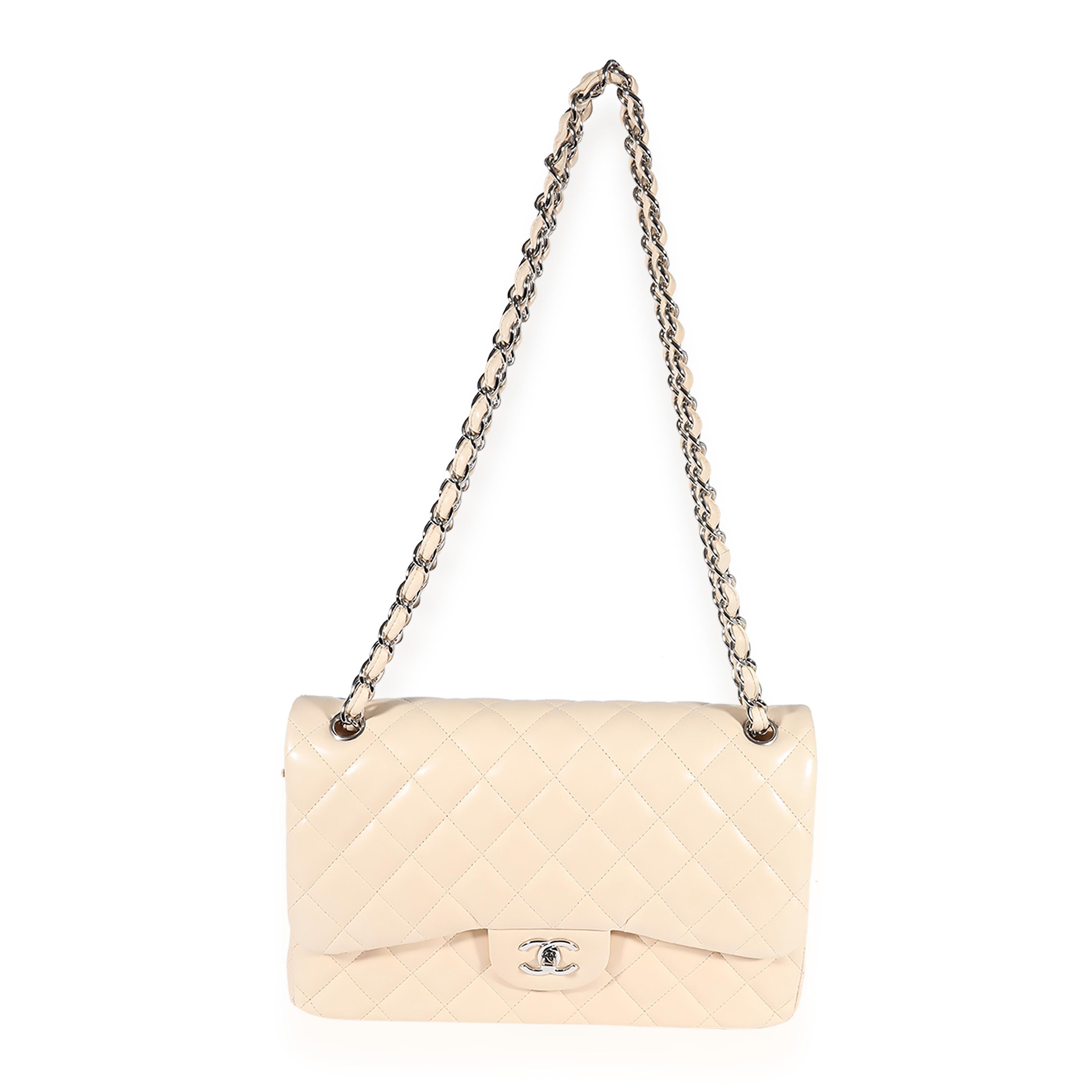 Listing Title: Chanel Beige Quilted Lambskin Jumbo Classic Double Flap Bag
SKU: 123157
MSRP: 9500.00
Condition: Pre-owned 
Handbag Condition: Very Good
Condition Comments: Very Good Condition. Light discoloration throughout leather. Scuffing and