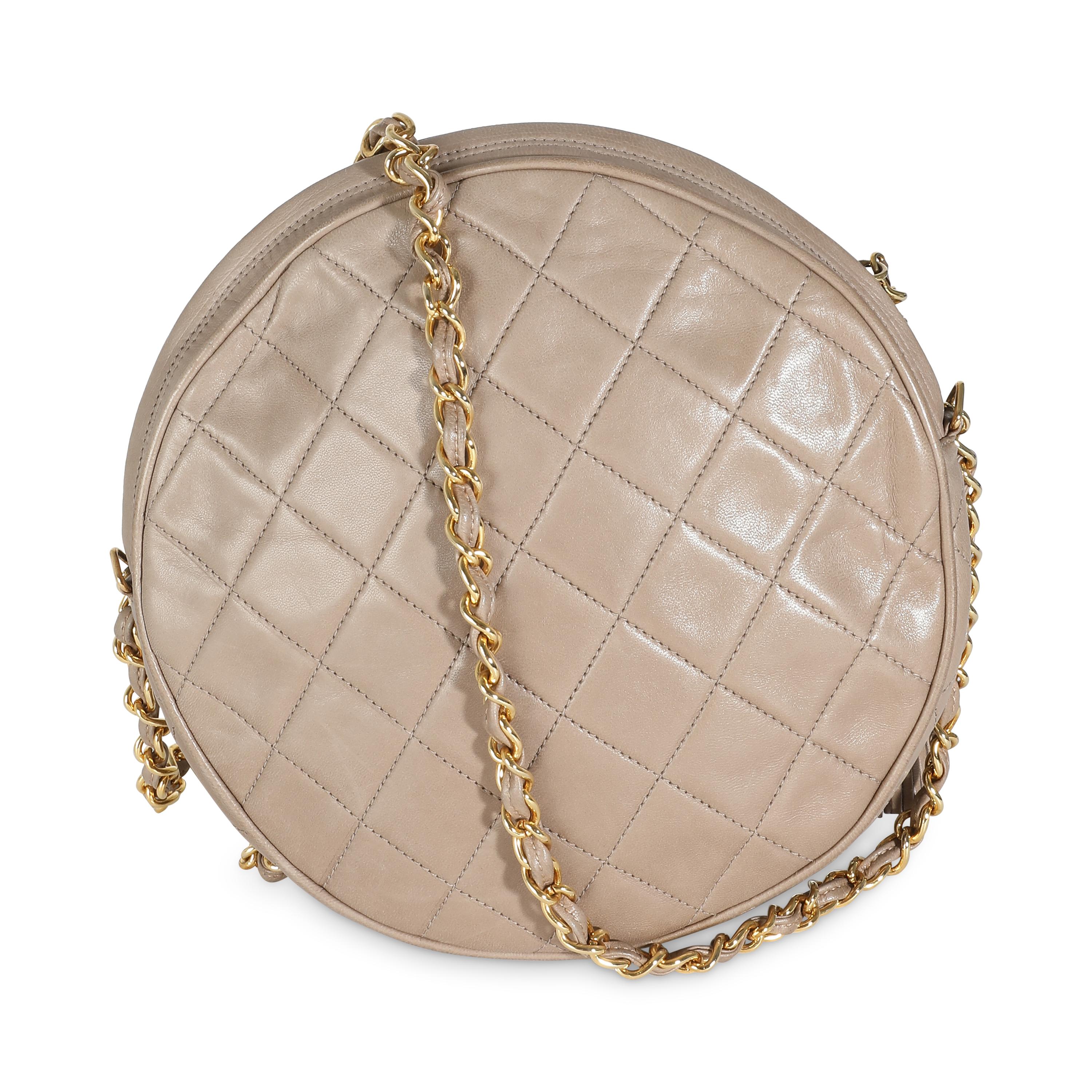 Listing Title: Chanel Beige Quilted Lambskin Round Tassel Chain Bag
SKU: 141431
Condition: Pre-owned 
Handbag Condition: Good
Condition Comments: Item is in good condition with apparent signs of wear.   Scuffing along edges. Marks along interior.