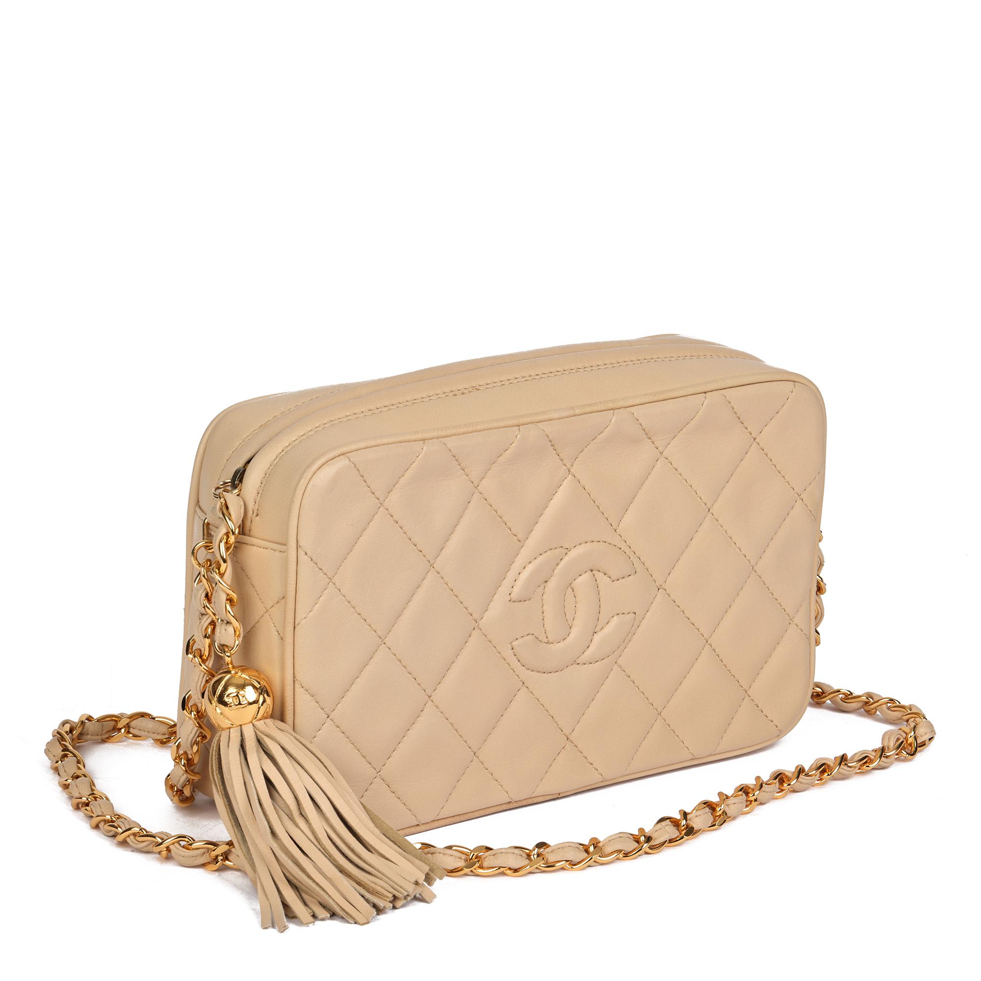 CHANEL
Beige Quilted Lambskin Vintage Small Fringe Timeless Camera Bag

Serial Number: 3174073
Age (Circa): 1994
Accompanied By: Authenticity Card
Authenticity Details: Authenticity Card, Serial Sticker (Made in Italy)
Gender: Ladies
Type: Shoulder,