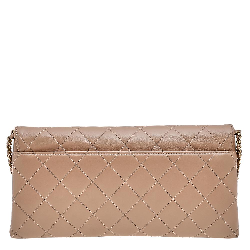 This modern update on the classic flap bag by Chanel is for those who love to bring the new and the old together. Crafted from quality leather, this beige flap bag is made in Italy. The front flap carries a striking enchained logo detail while the