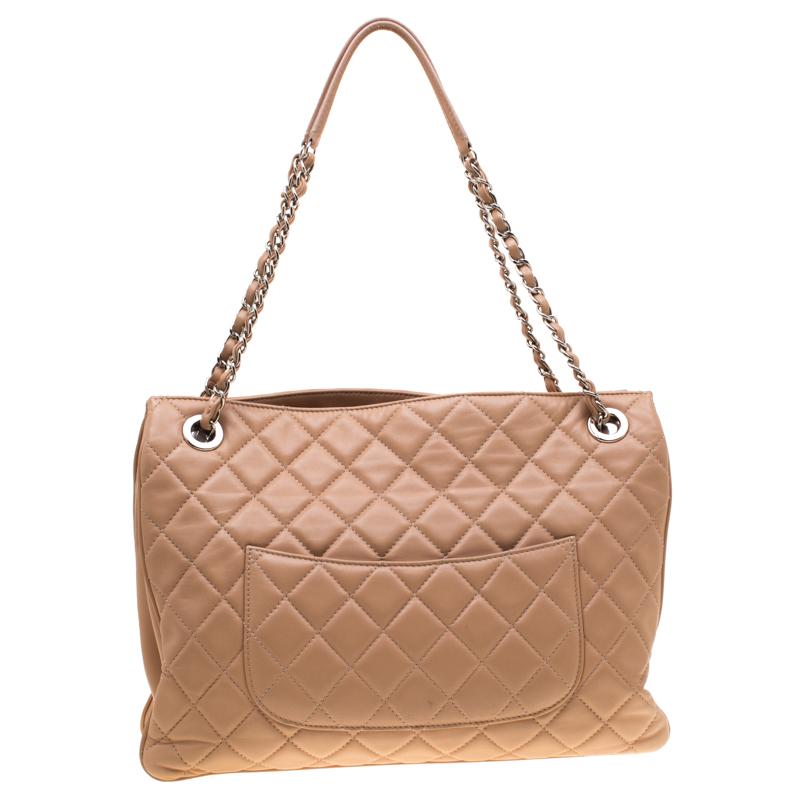 Chanel's bags are iconic and monumental in the history of fashion. Therefore, this elegant and charming shoulder bag is a worthy buy you can flaunt wherever you go. The classic creation is crafted from a muted beige leather and features the