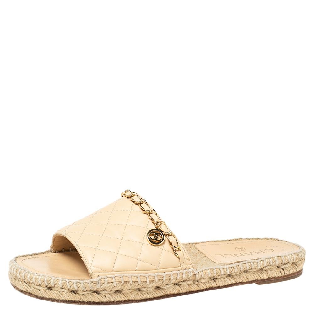 Chanel promises an elevated finish to your spring-summer style with these espadrille slides. The flats have quilted leather uppers graced by a chain trim and the comfy insoles are mounted on durable soles.

Includes: Original Dustbag