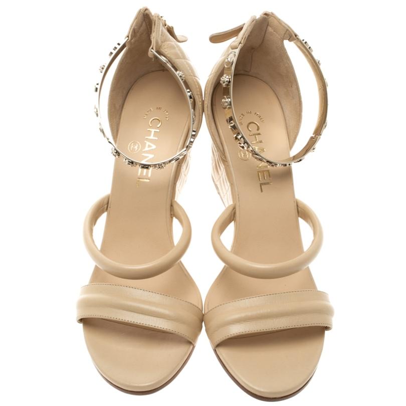 A beautiful pair of wedges will take you through the day and even in the night with the comfort of walking in them, these Chanel wedge sandals perfectly combine style with luxury. Constructed in beige leather, the wedge heel and back support feature