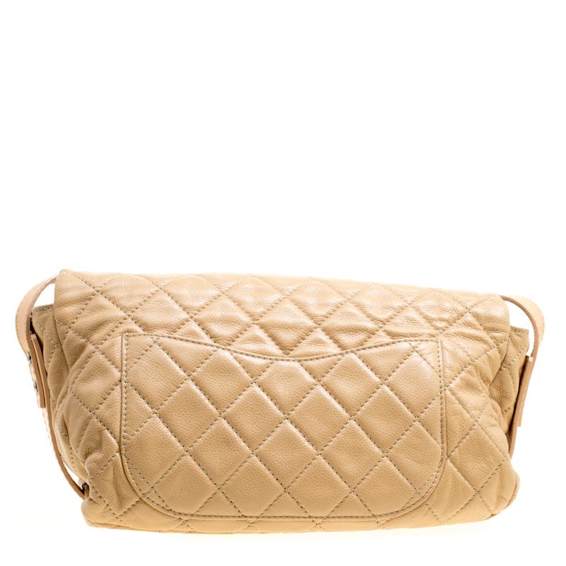 Radiate with classic style when you swing this crossbody bag from Chanel. Beautifully crafted from leather in beige, and designed with quilts all over it features the iconic Mademoiselle lock. It comes with a spacious fabric interior, a slip pocket