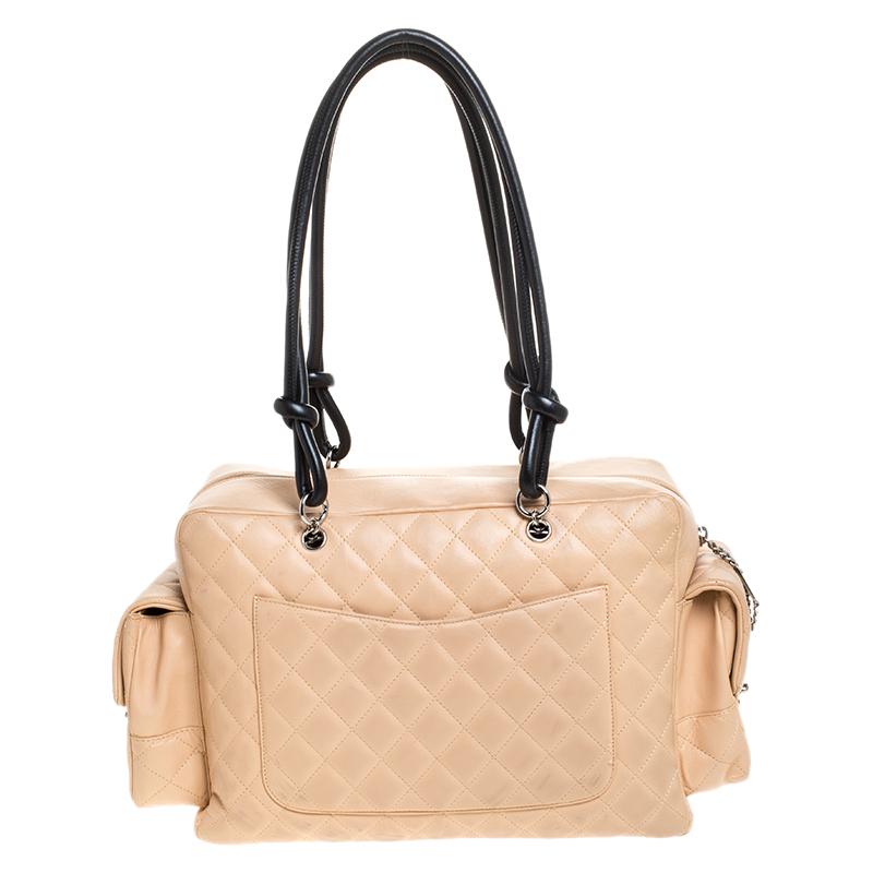The Chanel Ligne Cambon bag has a huge fan following. This beige leather bag draws inspiration from classic utility bags and has the iconic Chanel quilted pattern. It has abundant exterior multi-pockets with CC turnlock closures offering you