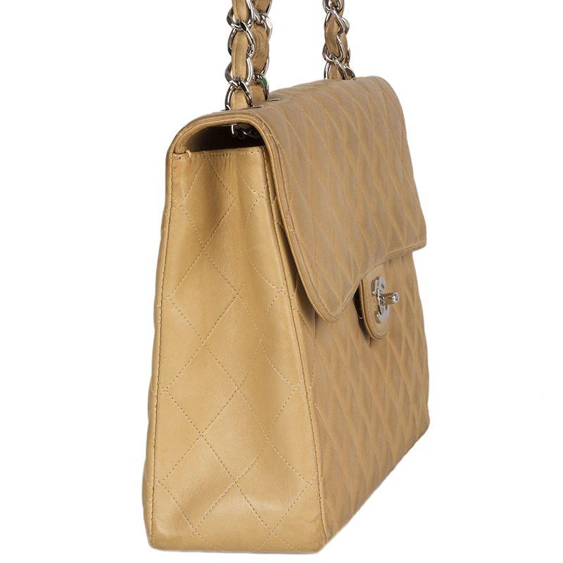 Chanel Vinatge 'Maxi Classic Flap' in beige calfskin. Open with CC turn lock and is lined in beige leather with one zipper pocket and one open pocket against the back. Has been carried with overall soft color transfer and natural patina. Comes with