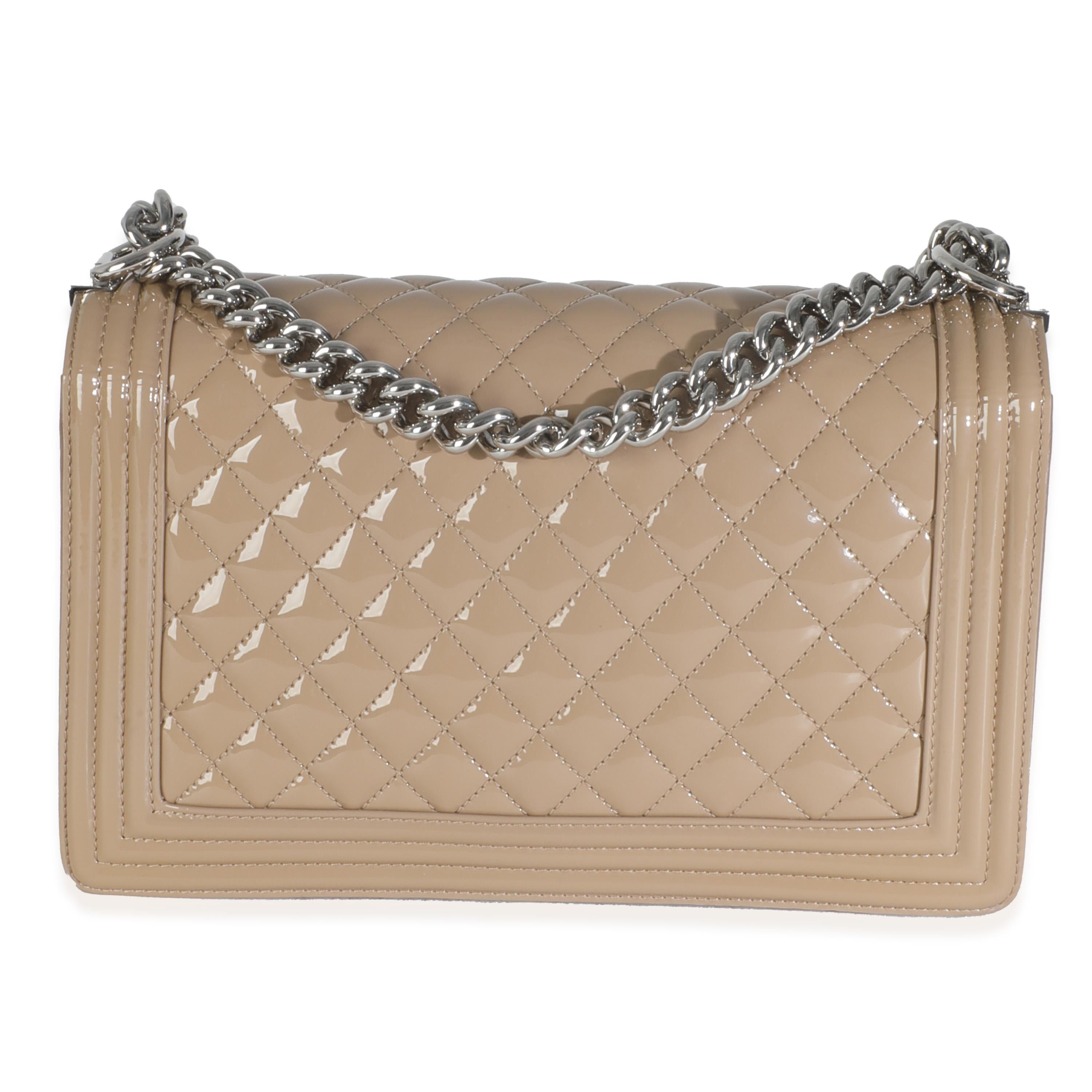 Listing Title: Chanel Beige Quilted Patent Plexi New Medium Boy Bag
SKU: 145903
Condition: Pre-owned 
Condition Description: An instant classic, the Boy bag from Chanel was introduced in 2011. The quilted bag was designed by the late Karl Lagerfeld,