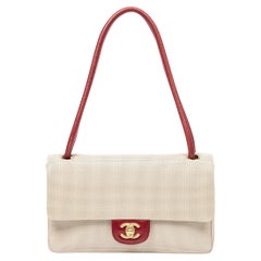 Chanel sac à rabat CC Turnlock en cuir perforé beige/rouge