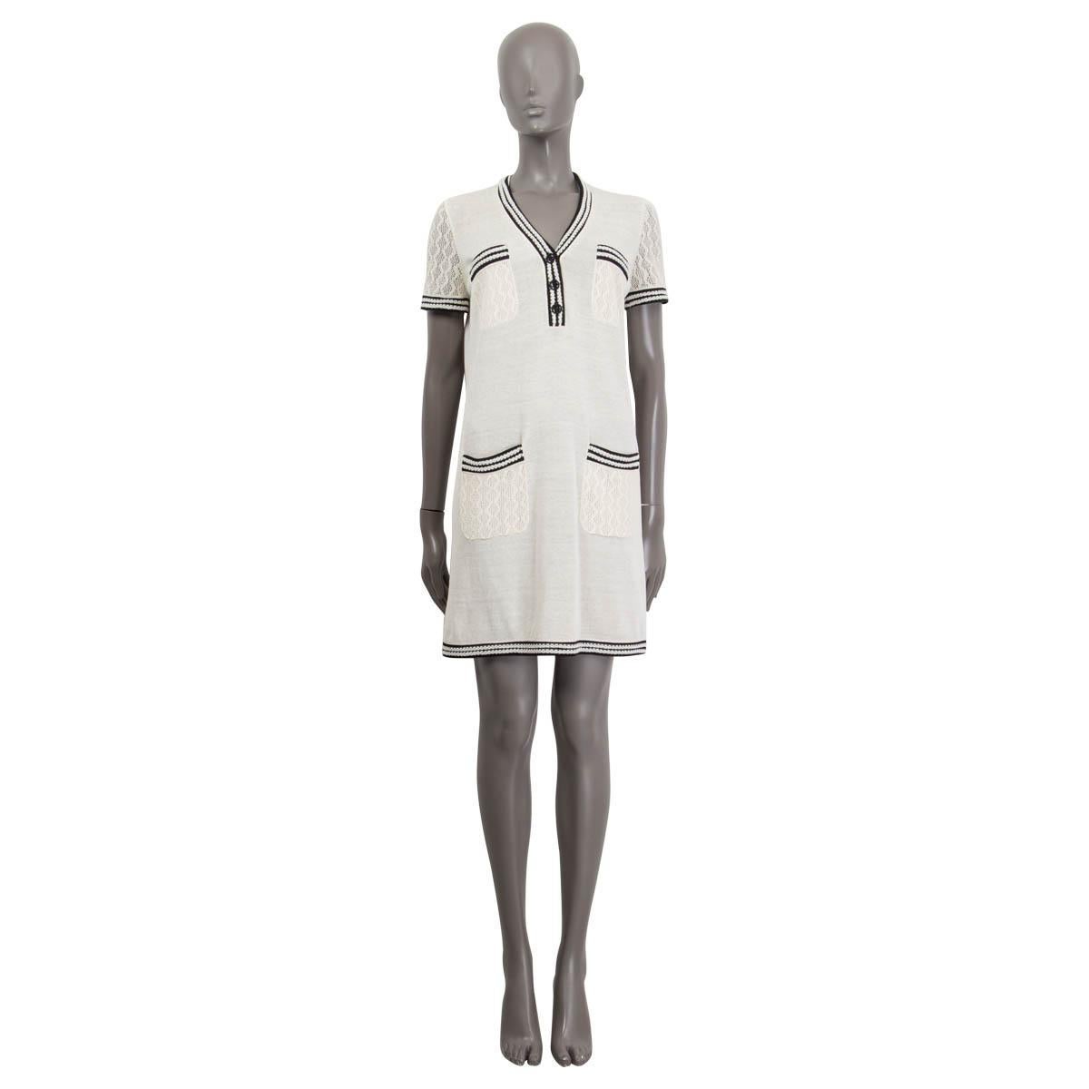 100% authentic Chanel Pre-Spring 2019 short sleeve knit dress in beige silk (87%) and polyester (13%). Features a deep v-neck and a crochet trim in black and off-white. Has four patch pockets at the front. Opens with three black 'CC' buttons at the