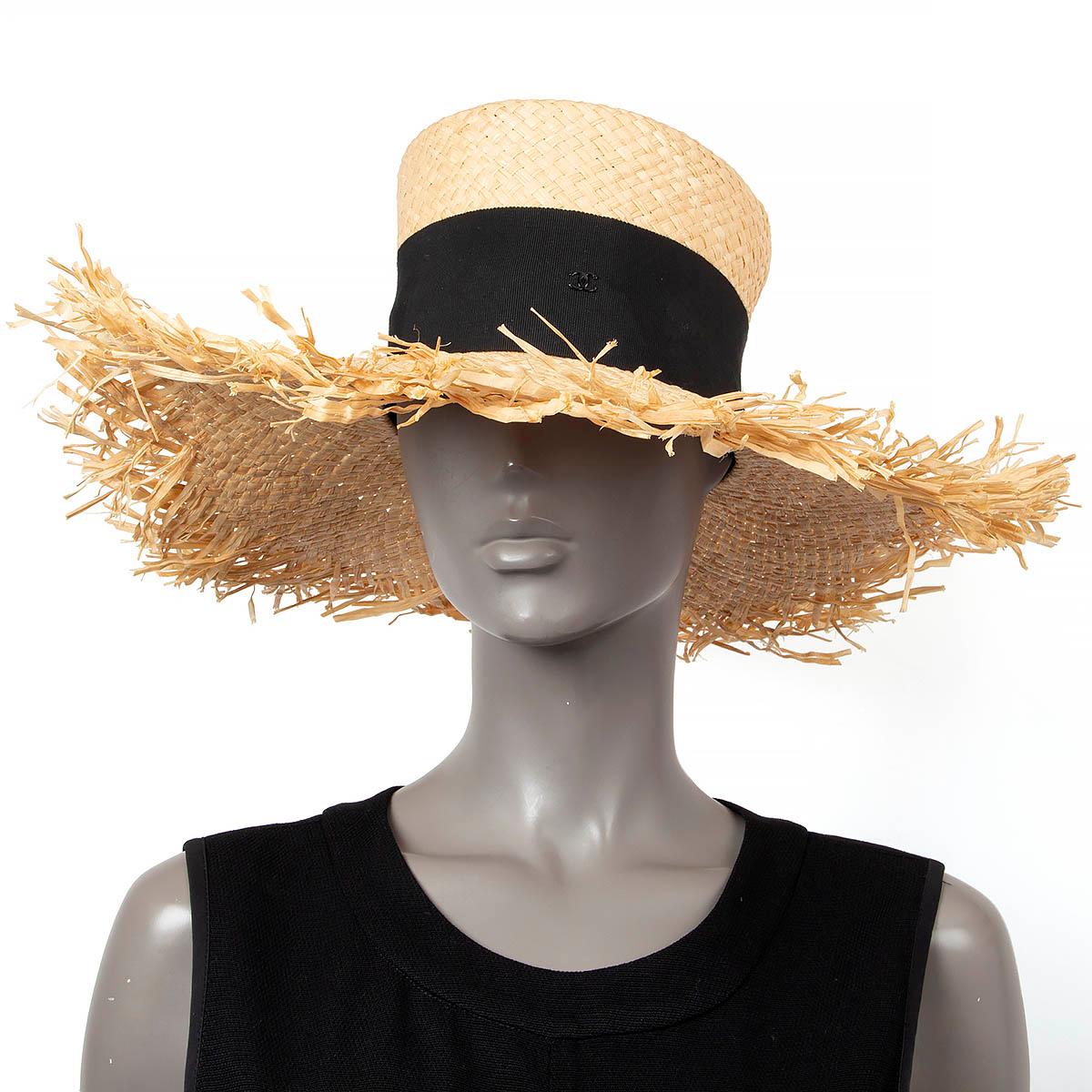 100% authentic Chanel wide brim beige raffia hat with black grosgrain band and CC logo. Has been worn and is in excellent condition. 

2019 Spring/Summer

Measurements
Model	Chanel19S AA0410
Tag Size	S
Inside Circumference	53cm (20.7in)

All our