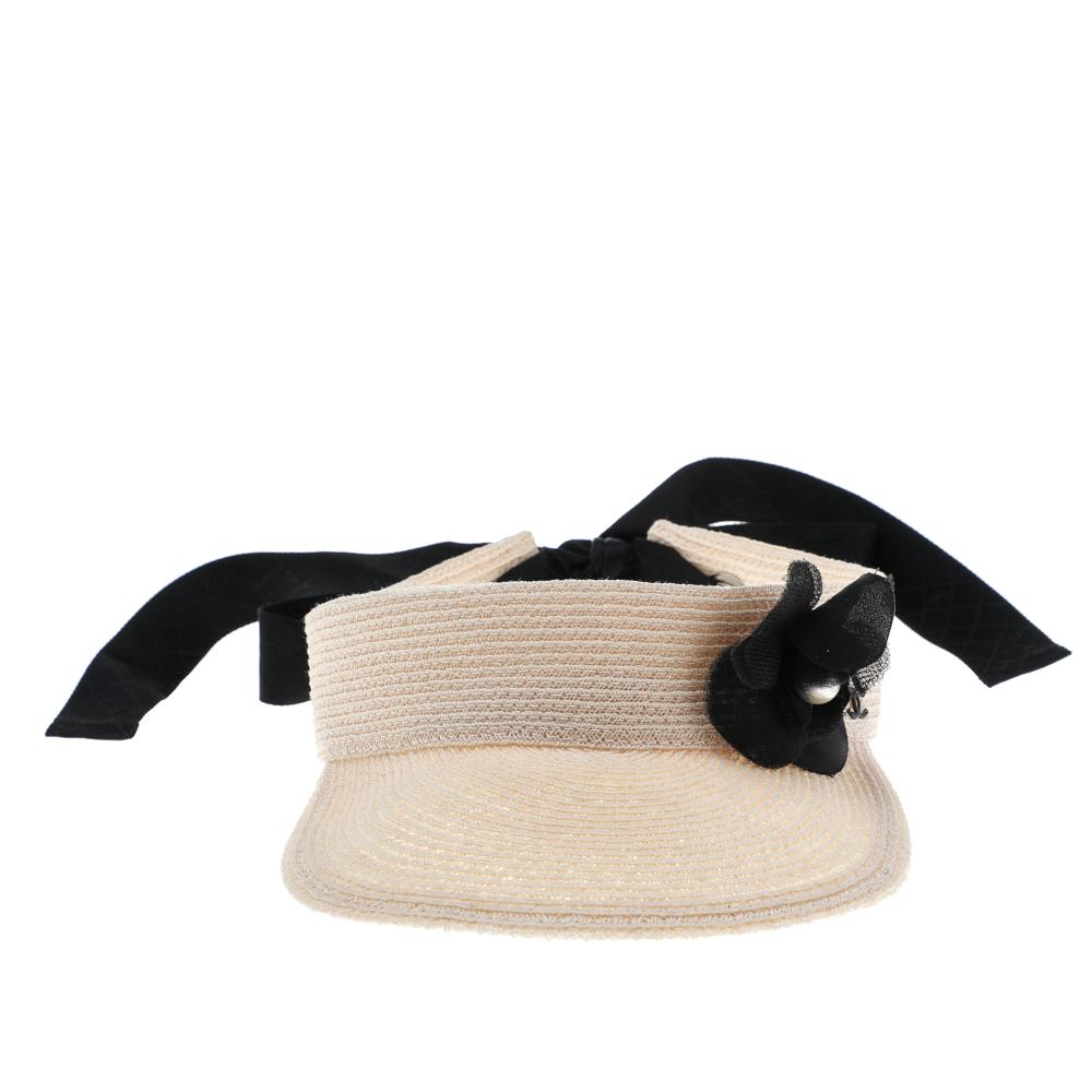 This visor hat from the House of Chanel is a great summer accessory to own. It is made from beige straw and comes with a tie-up feature. It has the signature Camelia motif on the front.

Includes: Original Dustbag