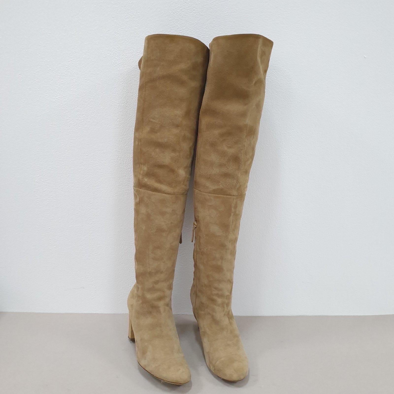 CHANEL beige suede over the knee boots from the 13B collection,  
Beige suede with cap toe detail; covered hexagonal heels. 
Pull on style with lower inner half zip; large interlocking CC embroidery at the inner toplines.
Sz.38
Very good
