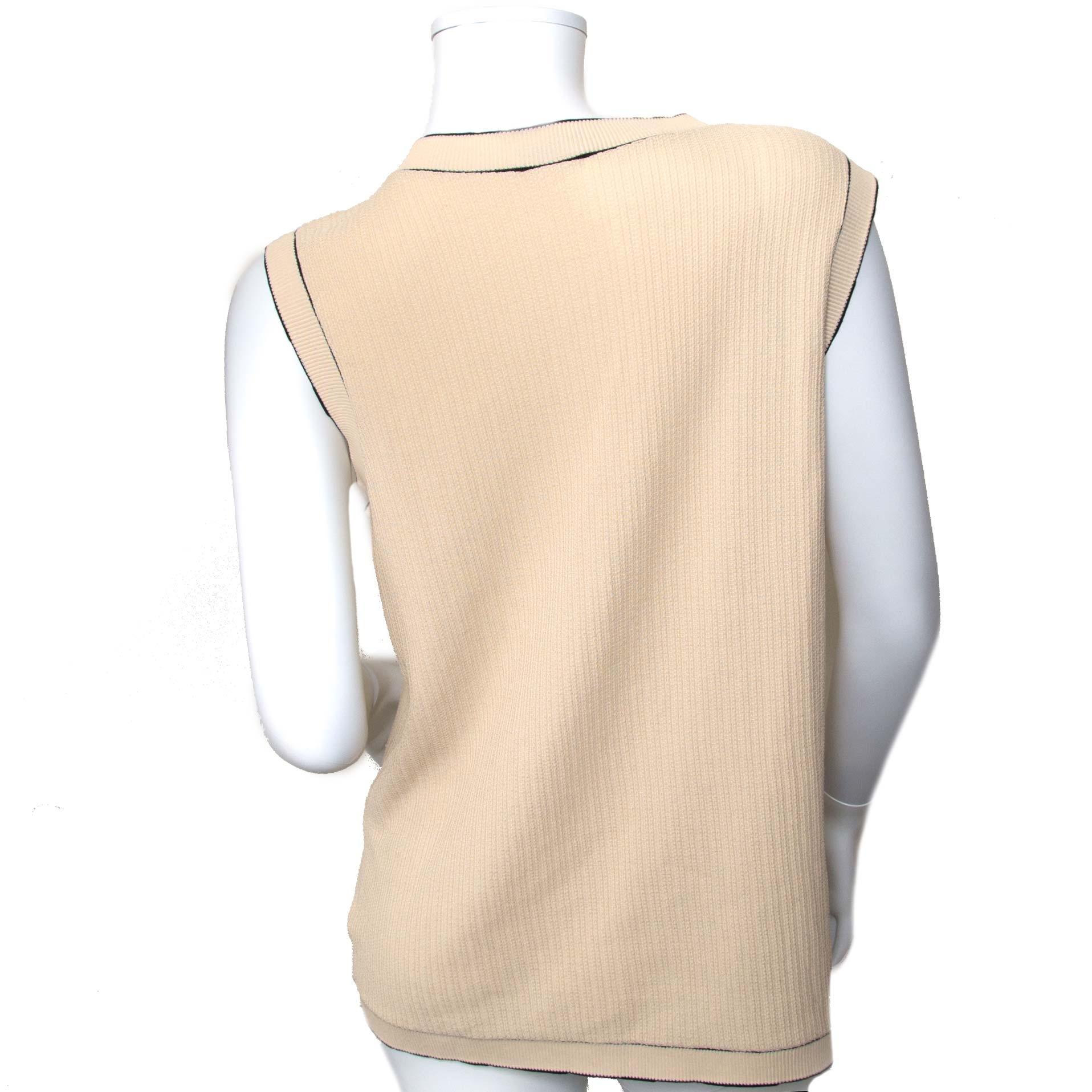 Brand New!

Chanel Beige Top - Size 48

This is a true timeless piece. 
The top is crafted in 100% beige cotton and features a black trim line and 5 Chanel logo buttons.
Upgrade your outfit to the next level with this Chanel item.

Comes with:

   