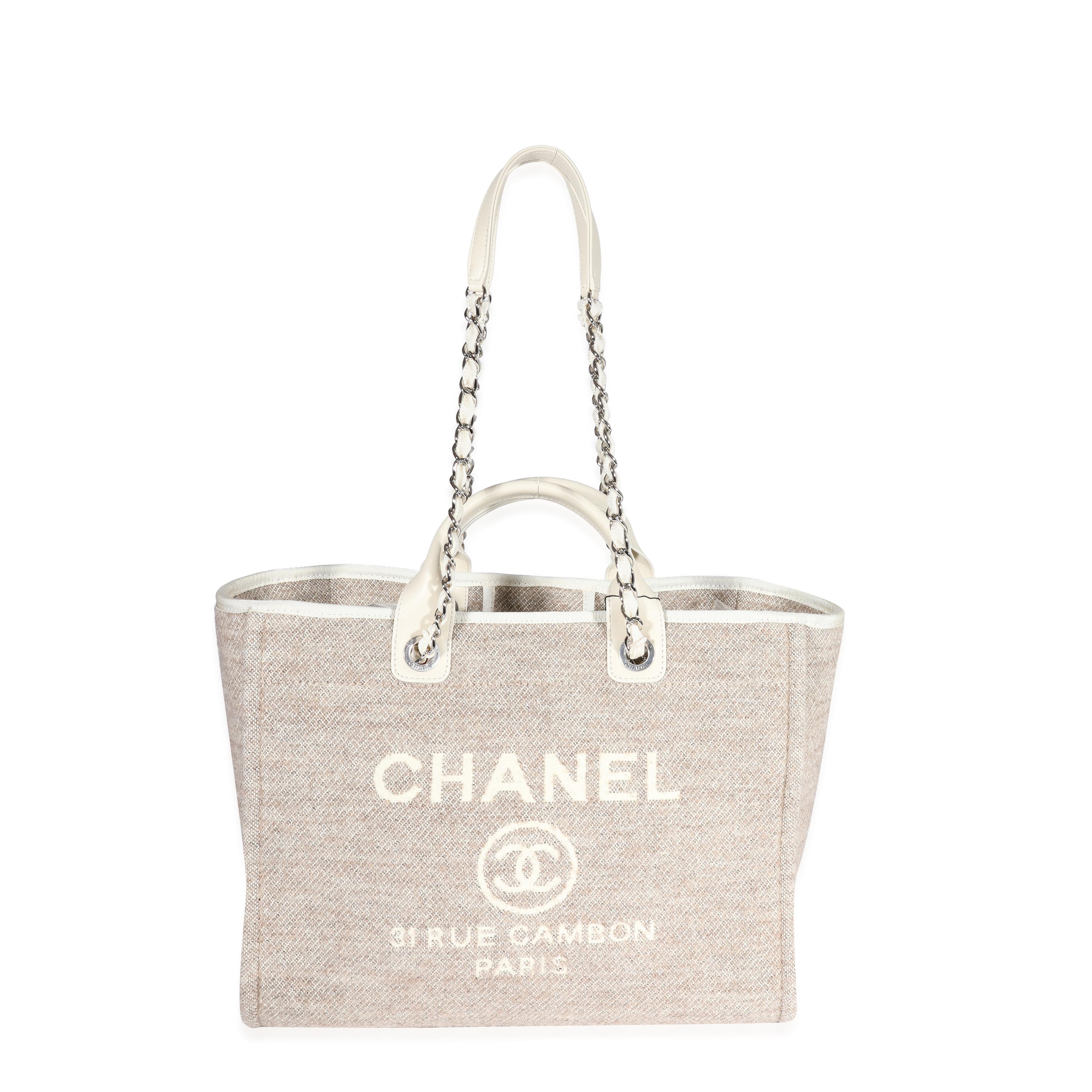 Listing Title: Chanel Beige Wool & Cream Leather Large Deauville Tote
SKU: 122739
MSRP: 3500.00
Condition: Pre-owned 
Handbag Condition: Mint
Condition Comments: Mint Condition. Plastic at some hardware. No signs of wear. Final sale.
Brand: