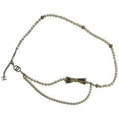 CHANEL Belt entirely in Pearls and a Bow Paved with Rhinestones and Mini Pearls