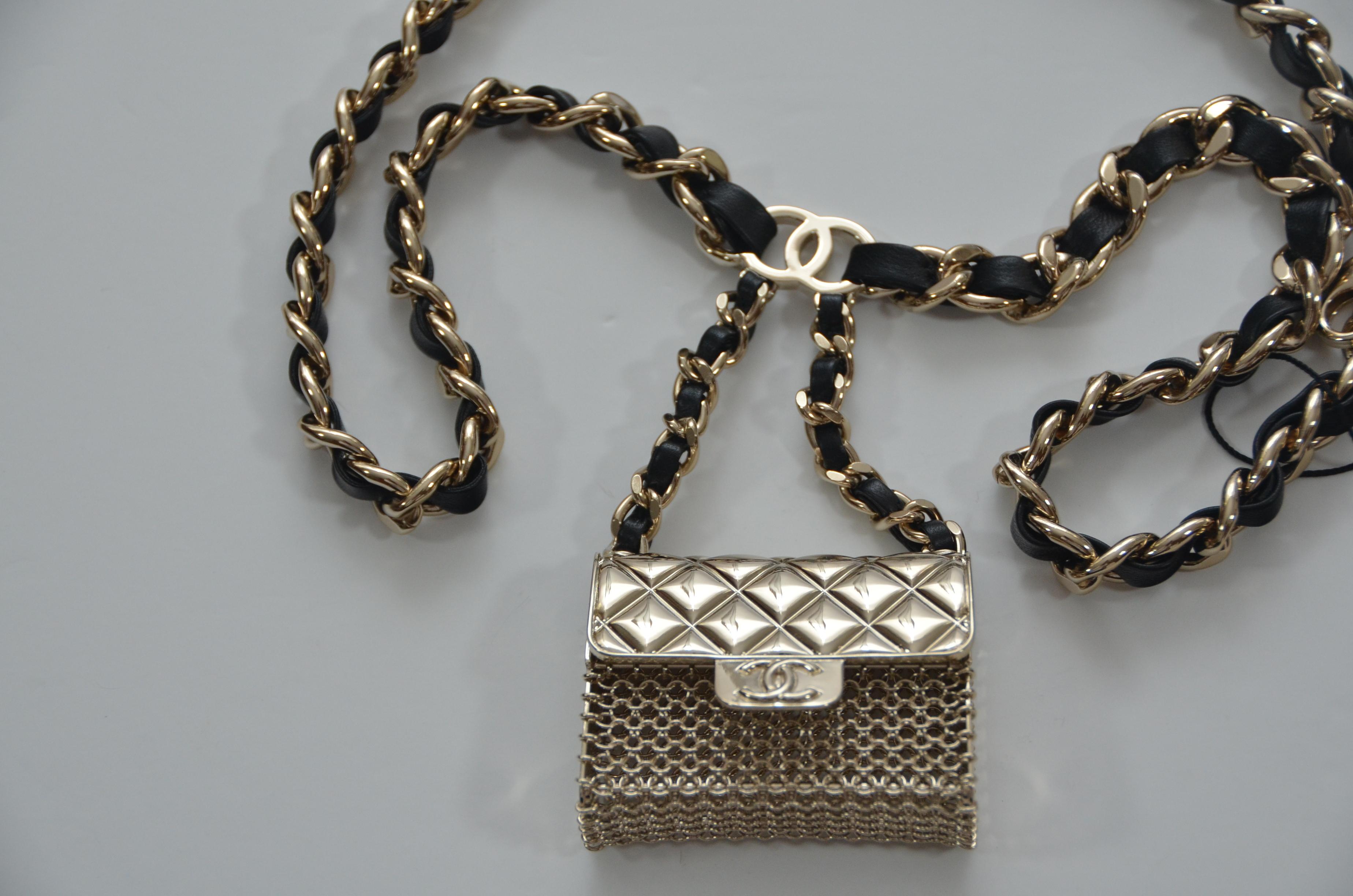 100% Chanel authentic guaranteed 
Chanel adjustable belt with mini classic Chanel purse attached
Mini purse can be opened.
Size 75
Sold out in stores and very collectible
New store fresh, only taken out for photography 
Chanel box, tags and mini
