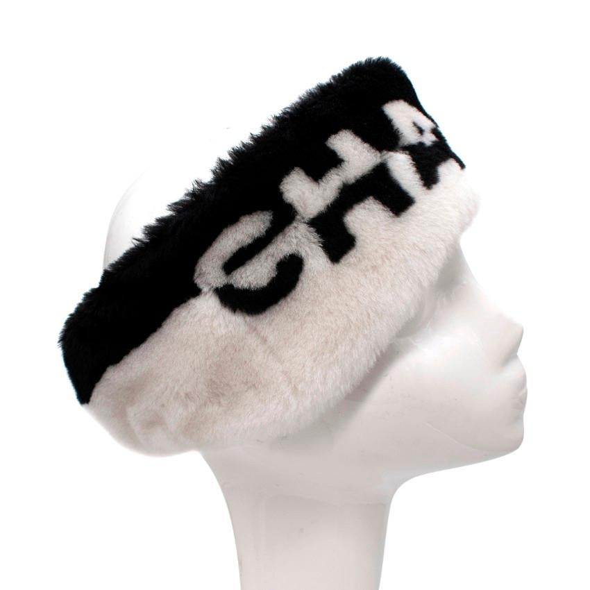 Chanel Bicolour Logo Shearling Winter Headband
 

 - Chic winter headband featuring monchrome brand logo rendered in soft shearling
 - Cashmere lined for added luxury and comfort
 - Gently elasticated for secure fit and comfort
 - Ergonomically