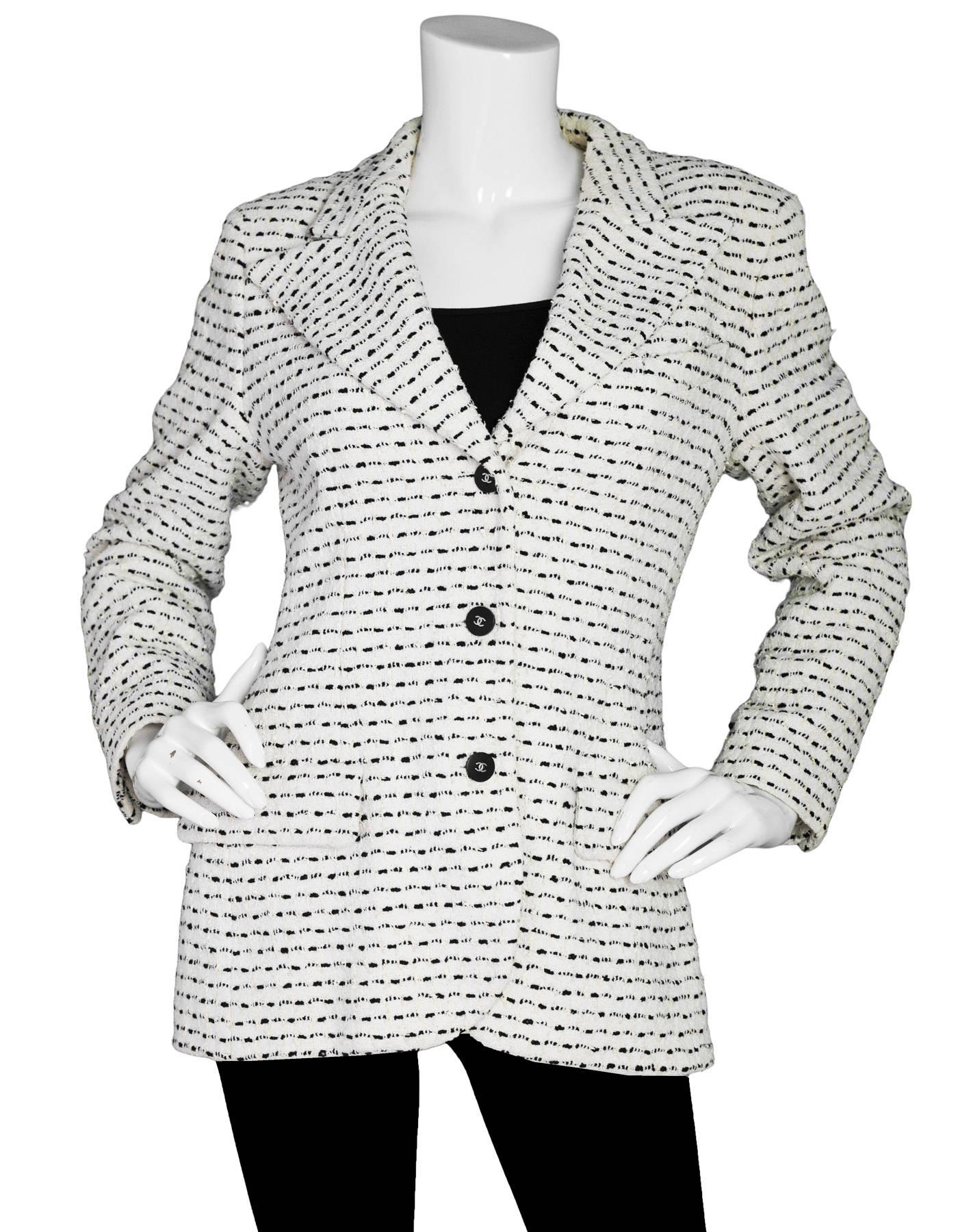 Chanel Black & White Tweed Jacket

Color: Black, white
Composition: 79% cotton, 12% wool, 5% spandex, 4% nylon
Lining: White silk blend
Closure/opening: Front button closure
Exterior Pockets: Two faux flap pockets
Interior Pockets: None
Overall