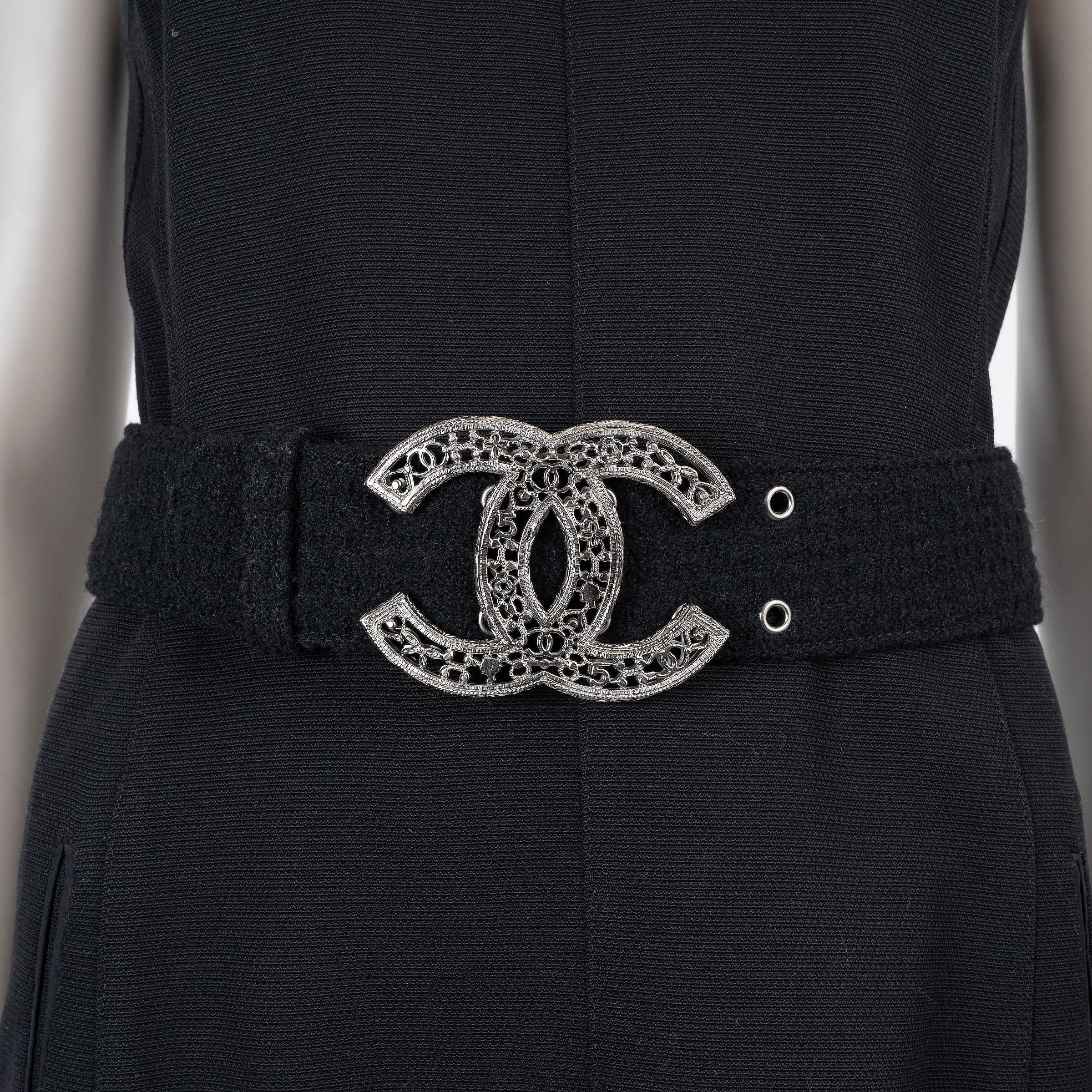 This 100% authentic Chanel wide belt in black tweed embodies timeless sophistication with a signature house touch. Featuring a striking filigree silver-tone metal CC buckle, it seamlessly blends classic craftsmanship with modern elegance. A