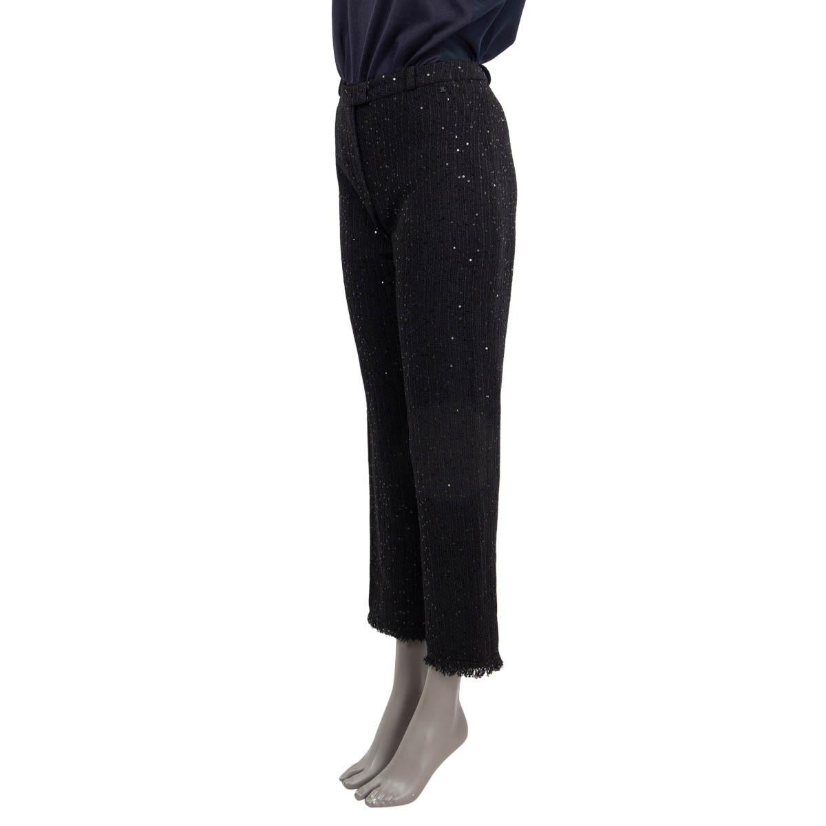 100% authentic Chanel straight tweed pants in black nylon (54%), wool (24%) and polyester (22%). Features all over the pants sequin embellished and fringe bottom hem. Closes with a concealed zipper and one hook on the front. Lined in black silk