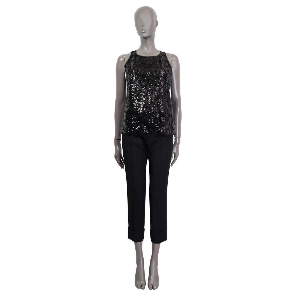 100% authentic Chanel 2015 floral sequin embellished sleeveless shirt in black polyester (100%). Opens with a concealed zipper and a hook at the back. Lined in black silk (100%). Has been worn and is in excellent condition.

Measurements
Tag