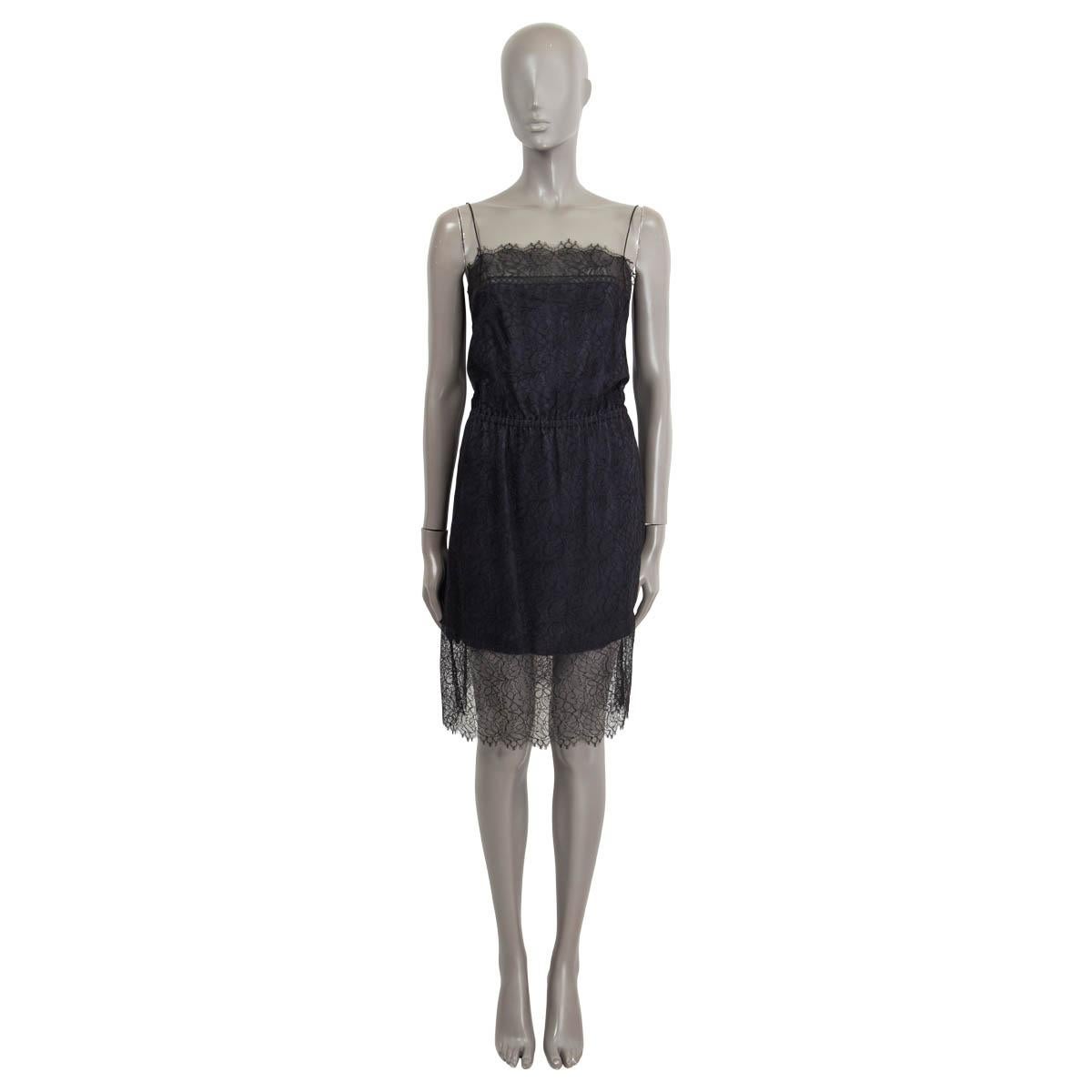 100% authentic Chanel sleeveless chantilly lace mini dress in black and navy polyamide (47%), viscose (41%) and cotton (13%). Opens with two 'CC' buttons, a hook and a zipper on the back. Lined in navy blue silk and elastane (assumed cause tag is