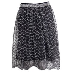 CHANEL Jupe noire plissée en tissu verni, 2018, 38 S
