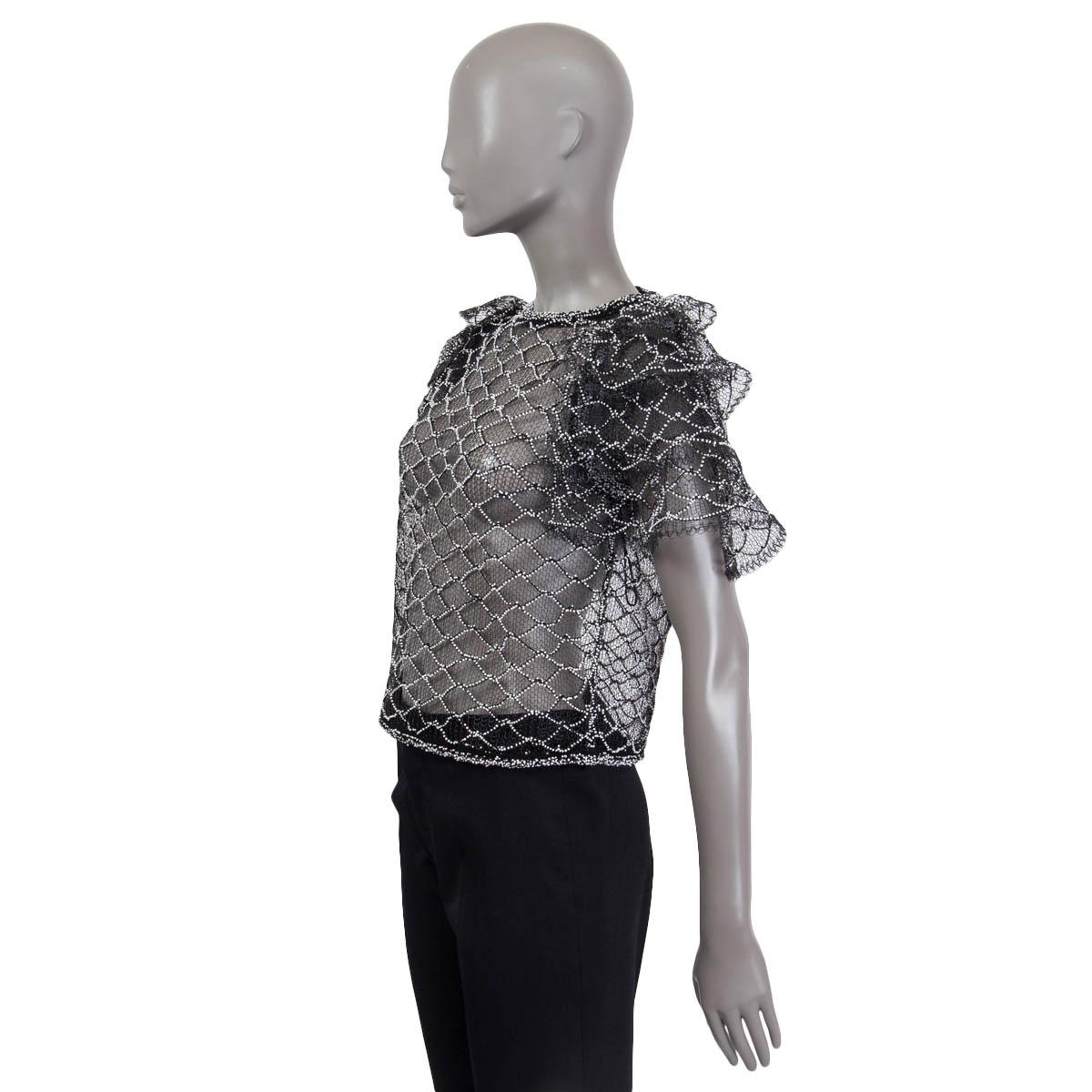 100% authentic Chanel Spring/Summer 2018 beaded top in black polyester (95%) and cotton (5%). Features puff sleeves and opens with a 'CC' button on the back. Unlined. Has been worn once and is in virtually new condition.

Measurements
Tag