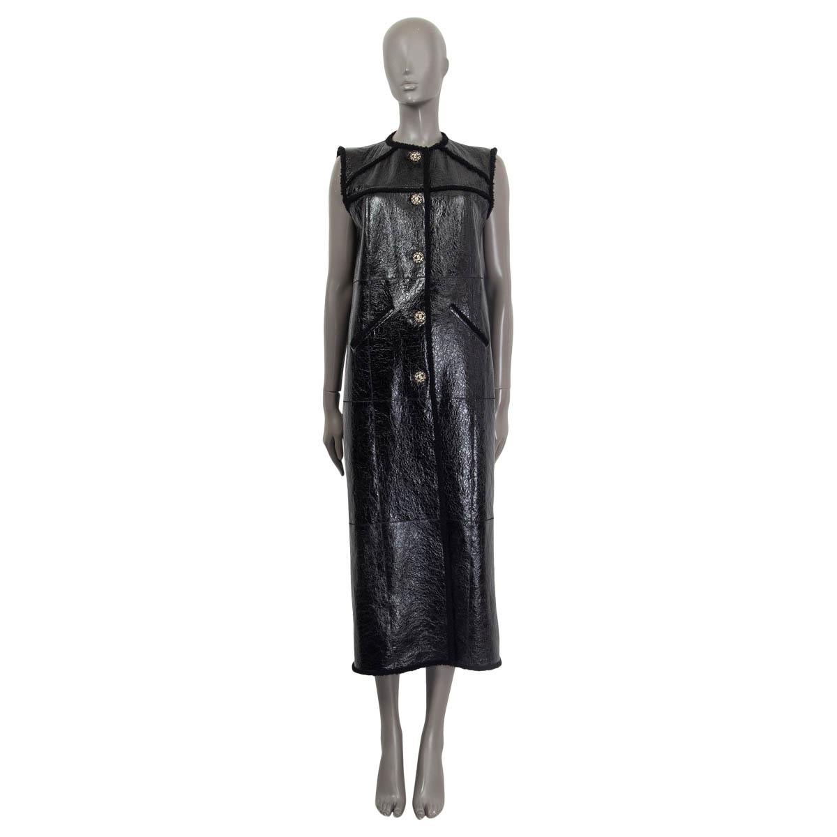 100% authentic Chanel Fall/Winter 2018 sleeveless cracket coat in black dyed lamb leather and shearling (100%). Features a shearling trim and two slit pockets on the front. Opens with five 'CC' buttons on the front. Has been worn once and is in