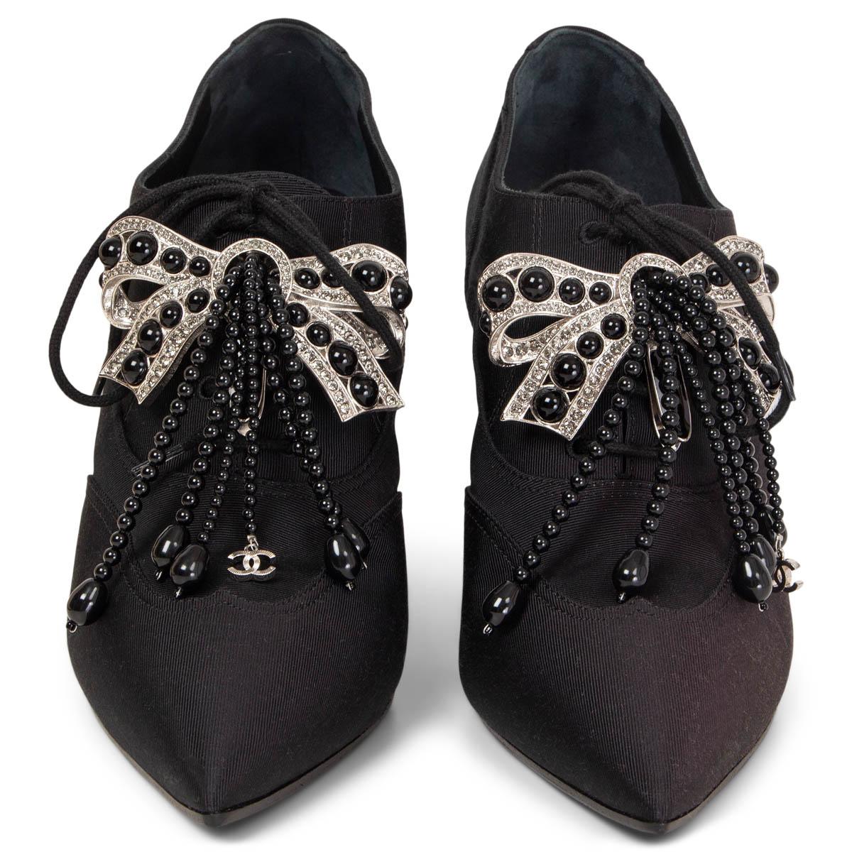 100% authentic Chanel 2018 Hamburg Collection lace-up booties in black grosgrain with silver-tone metal bow embellished with rhinestones and black beads. Brand new. Come with dust bag. Black thin rubber sole has been added.

Measurements
Imprinted