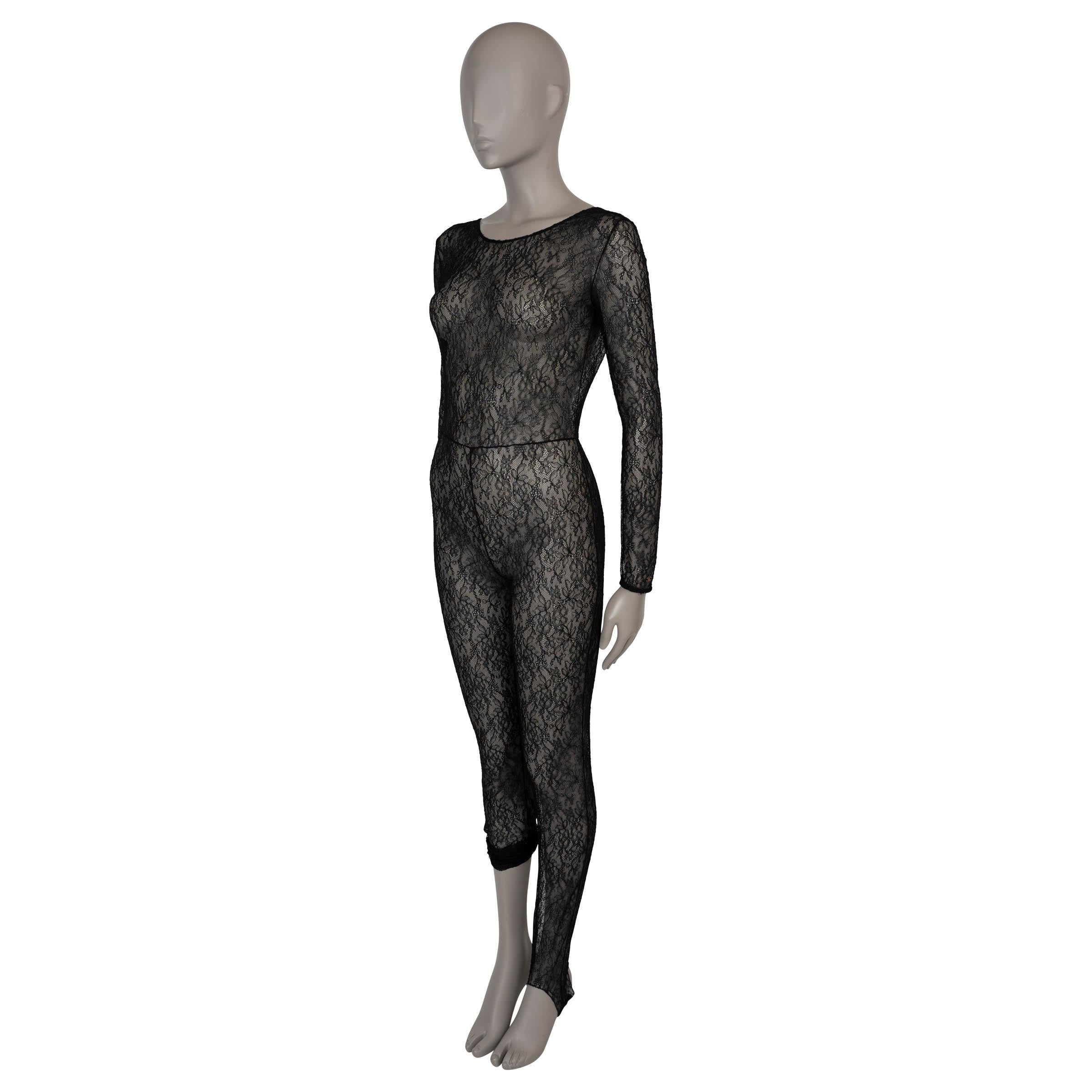 This 100% authentic Chanel jumpsuit in black floral lace offers a sheer, stretchy fabric that hugs the body with elegance and comfort. It features a bodycon silhouette with a refined crewneck, a flattering V-back, and 3/4 sleeves adorned with a