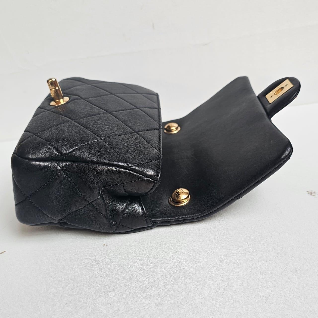 Chanel Mini Flap Bag with Circular Chain Top Handle Detail from recent collection. Already chipped. Item is overall still in good condition with light scratches and dirt marks due to wear. Unique design but top handle cant be removed. Comes with its